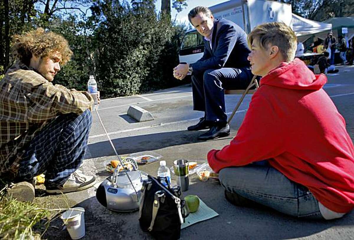 Mayor Gavin Newsom (center) talks to Jason Thomson ( left) and Jerry Zealand while he was visiting the people that attended the Project Homeless Connect, Thursday, Nov. 19, 2009, in the Golden Gate Park in San Francisco, Calif.