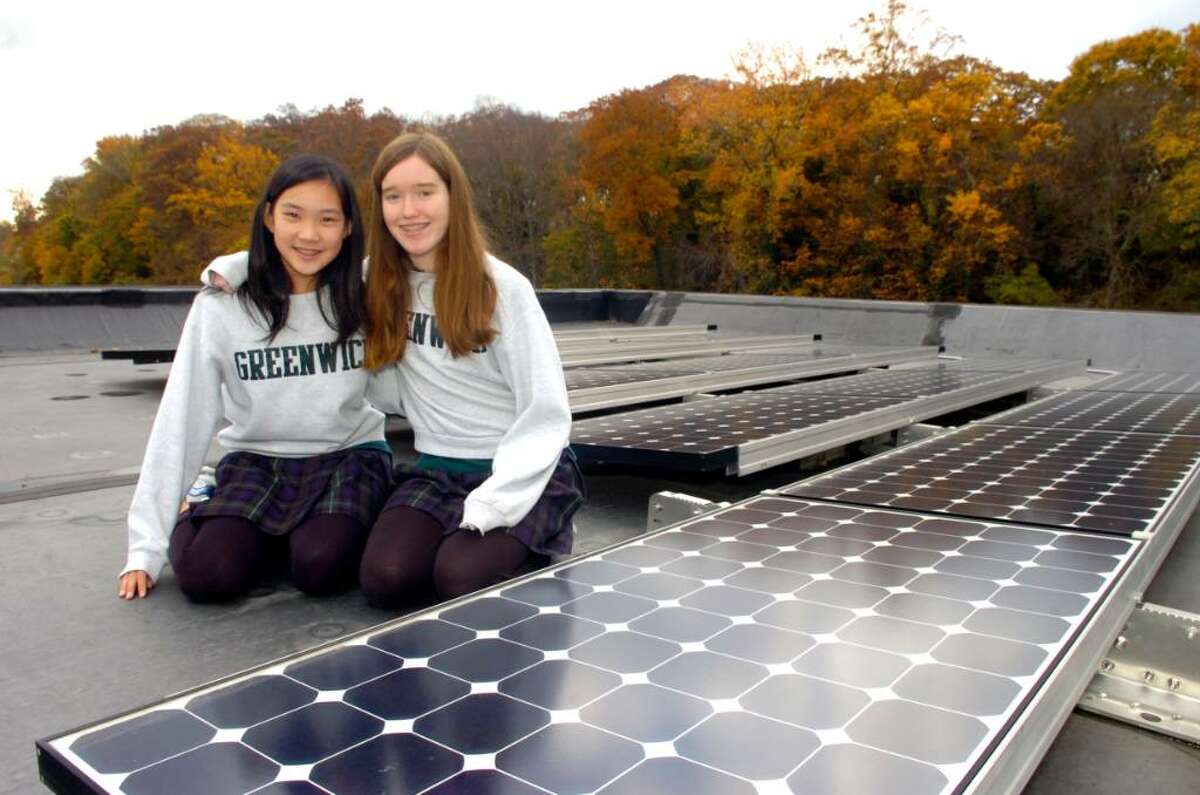 Greenwich, Nov. 5, 2009. Alicia Kiley, 13, 8th grade and Caroline Zhao, 12, 7th grade, who head the greening committee, get a look at the roof of the Greenwich Academy Middle School. The school was giving a tour of the new award-winning LEED-certified school building.