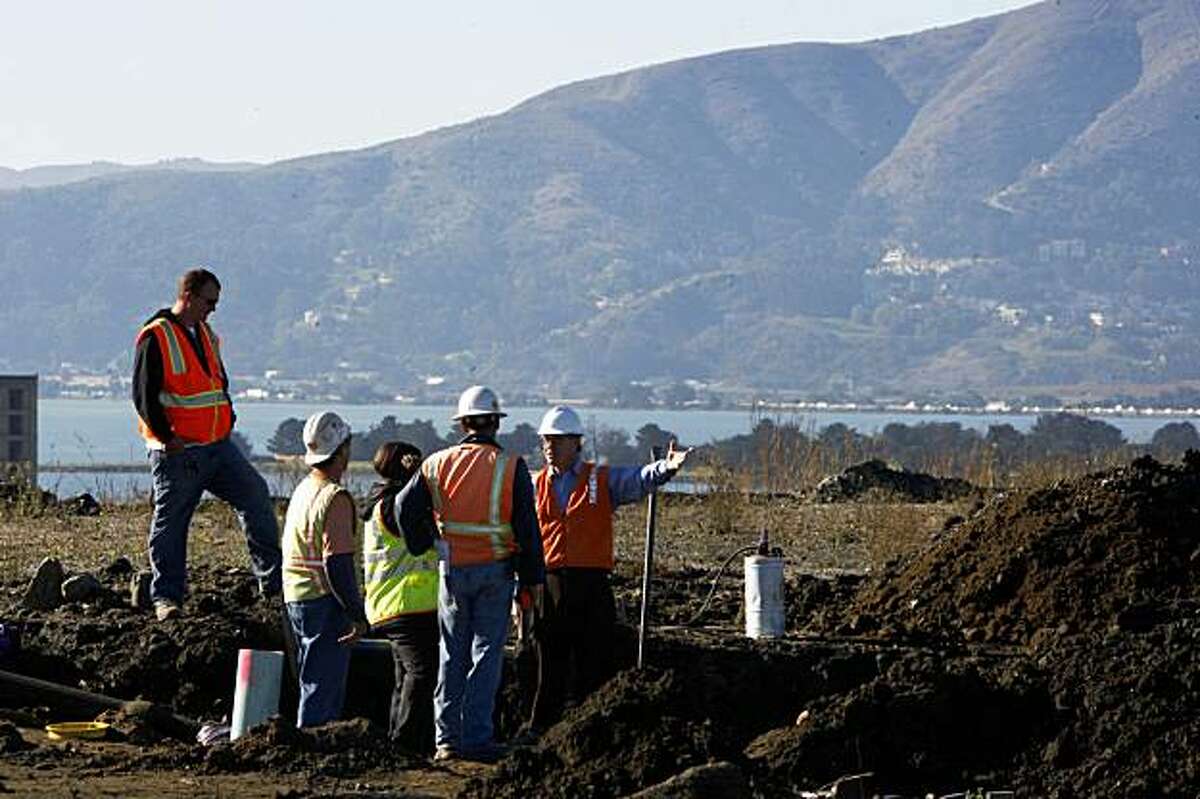 Working on the storm and sanitary sewer lateral installation on the newly-developed land that Lennar Corp. plans to build houses on, next to Hunters Point Shipyard in San Francisco, Calif., on Monday, November 2, 2009.