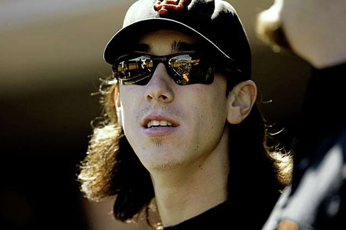 Giants pitcher Tim Lincecum watches from the dugout as the San Francisco Giants take on the San Diego Padres at AT&T Ballpark in San Francisco, Calif., on Wednesday September 9, 2009.