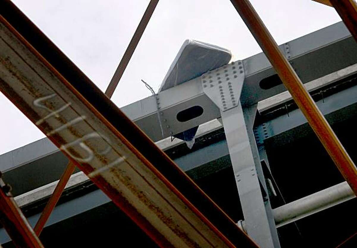 A mattress sits above the spot where the truck left the bridge. A CHP spokesman speculated that the bed was in the cab and came out on impact. A truck carrying pears plunged off the "s"-curve area of the Bay Bridge early Monday morning, landing on Yerba Buena Island and killing the driver November 9, 2009.
