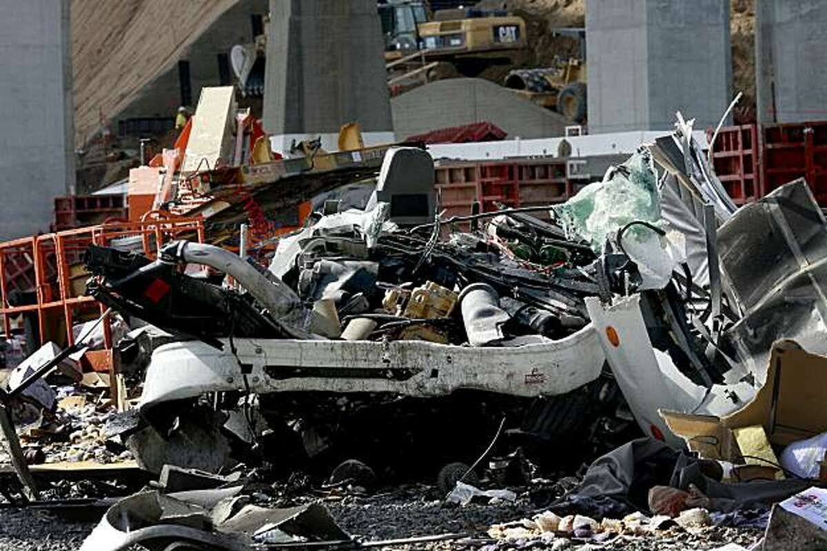 The cab of the truck lay crushed beneath the new S curve area of the Bay Bridge early Monday morning landing on Yerba Buena island and killing the driver November 9, 2009.
