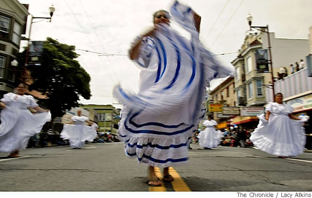 Jesseni Silva of the Grupo Folklorico Nicarao dance group shows off the full petticoat of her dress as the group dances down Mission Street in the 30th anniversary of the San Francisco Carnaval parade Sunday May 25, 2008, in San Francisco, Calif. Lacy Atkins / San Francisco Chronicle