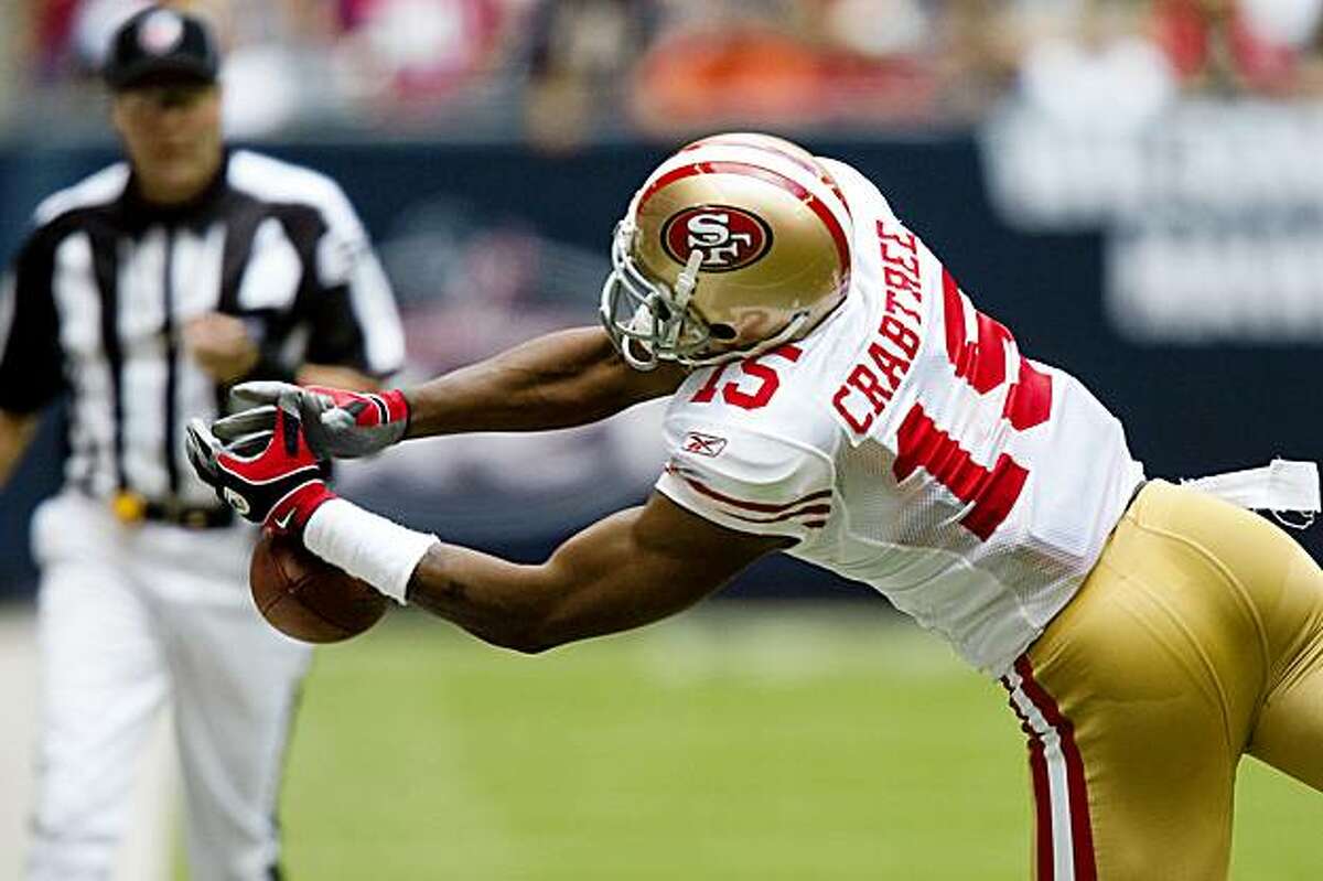 San Francisco 49ers wide receiver Michael Crabtree (15) can't hold onto a pass during the first half of an NFL football game against the Houston Texans at Reliant Stadium, Sunday, Oct. 25, 2009, in Houston.