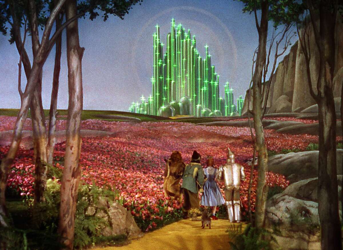 Dorothy, the Scarecrow, the Lion, and the Tin Man make their way to the Emerald City in "The Wizard of Oz."