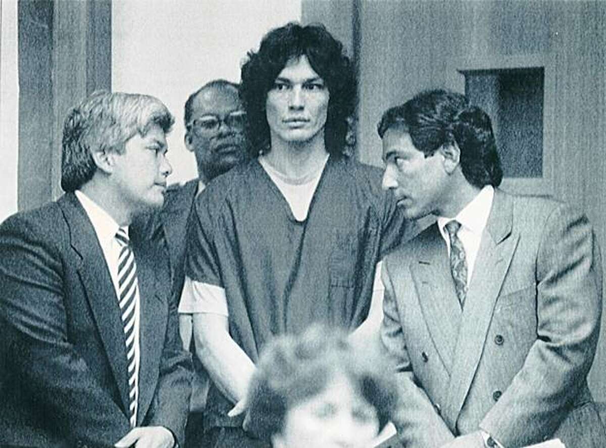 1990 - Richard Ramirez (center) who has been sentenced to death for 13 slayings in Southern California, appears Friday with his attorneys, Randall Martin (right), and Daro Inouye in San Francisco Municipal Court. AP Chronicle File
