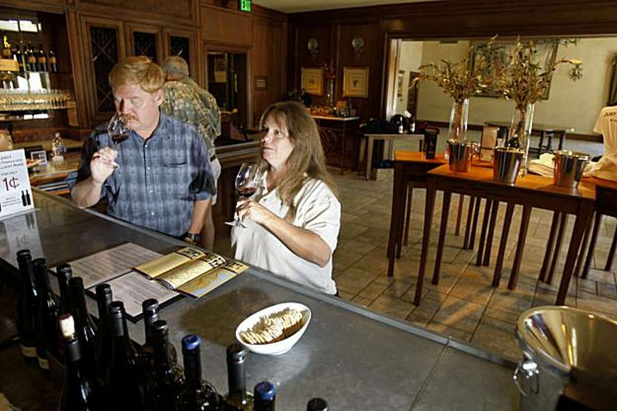 Randy Heald (l to r) and Linda Heald, both of Hayward, try out different wines in the tasting room at the Clos LaChance winery in San Martin, Calif. on Tuesday, September 15, 2009.