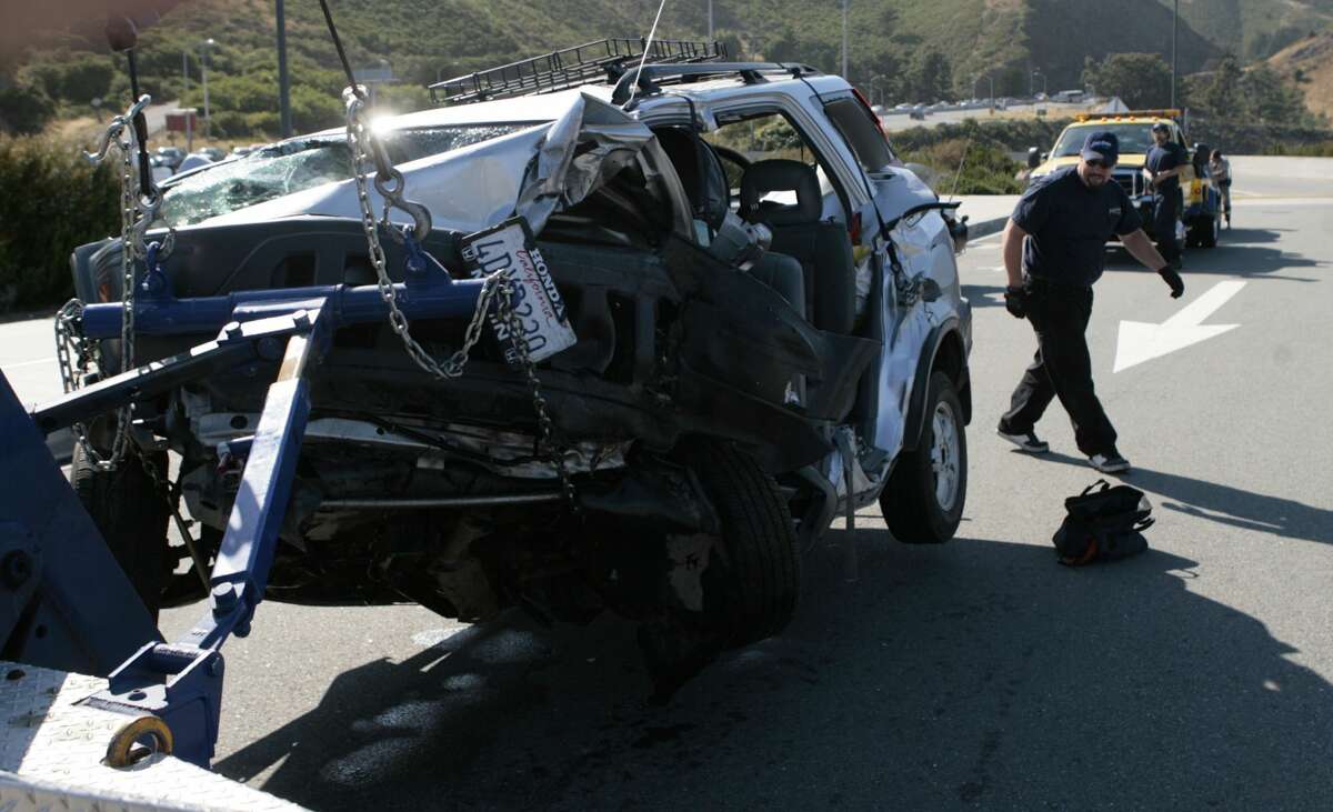 A tow truck operator inspects one of the cars involved in a crash on the Golden Gate Bridge on May 21, 2008. The crash snarled traffic and sent victims to the hospital.Photo by Kim Komenich / San Francisco Chronicle