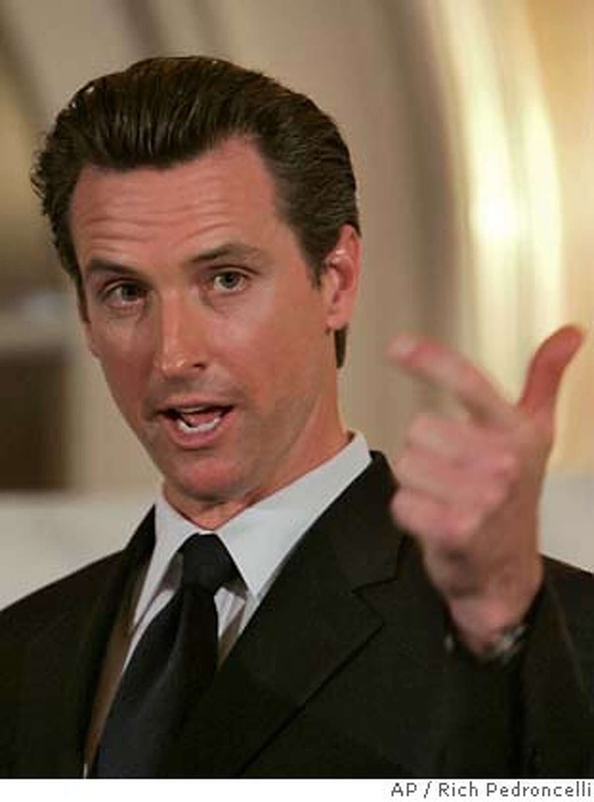 ###Live Caption:San Francisco Mayor Gavin Newsom gestures as he addresses the Sacramento Press Club in Sacramento, Calif., Tuesday, March 25, 2008. Newsom is criticizing deep cuts to California's Medi-Cal program and says he is considering a lawsuit to reinstate some of the funding. (AP Photo/Rich Pedroncelli)###Caption History:San Francisco Mayor Gavin Newsom gestures as he addresses the Sacramento Press Club in Sacramento, Calif., Tuesday, March 25, 2008. Newsom is criticizing deep cuts to California's Medi-Cal program and says he is considering a lawsuit to reinstate some of the funding. (AP Photo/Rich Pedroncelli) Ran on: 04-09-2008 Ran on: 04-09-2008 Ran on: 04-16-2008 Mayor Gavin Newsom thinks mandatory spending acts should have a known money source. Ran on: 04-16-2008 Mayor Gavin Newsom thinks mandatory spending acts should have a known money source. Ran on: 04-16-2008 Ran on: 04-16-2008 Ran on: 04-16-2008###Notes:Gavin Newsom###Special Instructions: