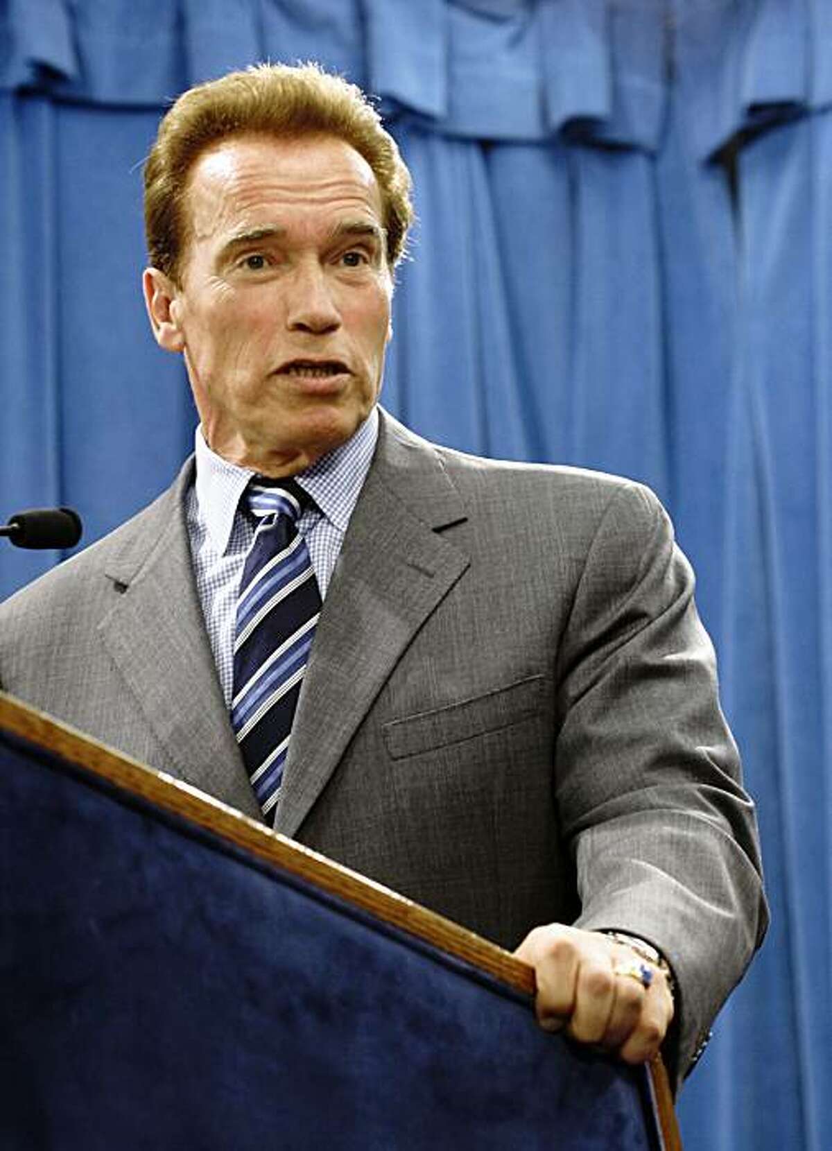 Gov. Arnold Schwarzenegger answers a reporter's question concerning the recommendation by the Commission on the 21st Century Economy to overhaul California's tax system at the Capitol in Sacramento, Calif., Tuesday, Sept. 29, 2009. Schwarzenegger said he would call a special session of the Legislature to take up the commissions plan to change the state's tax system.(AP Photo/Rich Pedroncelli)