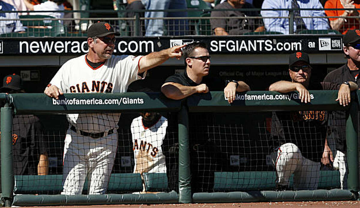 Giants manager Bruce Bochy coaches from the dugout during the last home game of the San Francisco Giants.