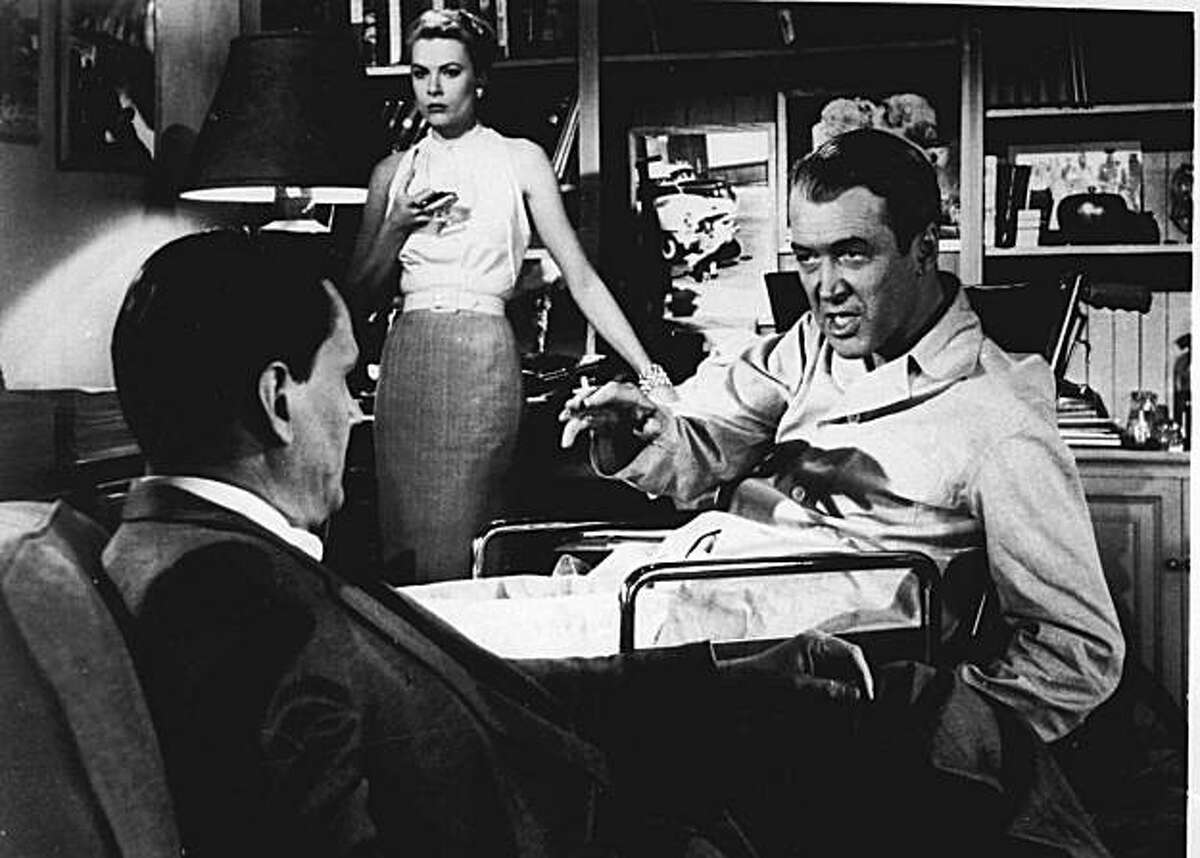 FILE---Jimmy Stewart right, Grace Kelly and Wendell Corey appear in a scene from "Rear Window", a film directed by Alfred Hitchcock in 1954. Jimmy Stewart, the lanky, slow-talking actor who embodied American decency and moral courage in such movies as ``Mr. Smith Goes to Washington'' and ``It's a Wonderful Life,'' died Wednesday at 89. Daily Variety columnist Army Archerd said Stewart's son told him the star died at his Beverly Hills home. (AP PHOTO/FILE) ALSO RAN 03/28/04