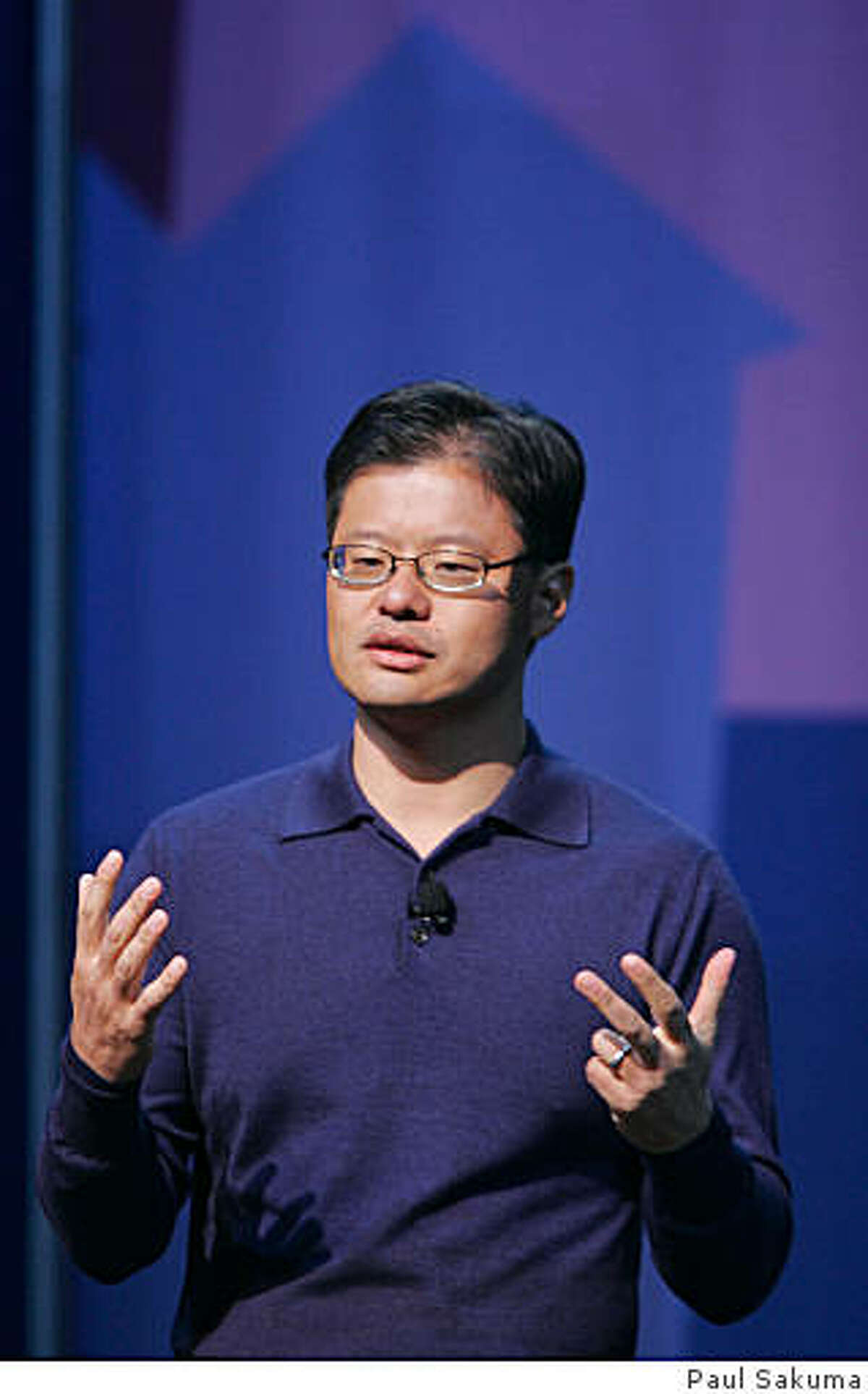 ** FILE ** Yahoo CEO Jerry Yang gives a keynote address at the Consumer Electronics Show (CES) in Las Vegas, in this Jan. 7, 2008 file photo. Yahoo Inc. Chief Executive Jerry Yang told employees Wednesday Feb. 6, 2008, that the struggling Internet pioneer is still examining ways to avoid a takeover by rival Microsoft Corp. (AP Photo/Paul Sakuma, file)