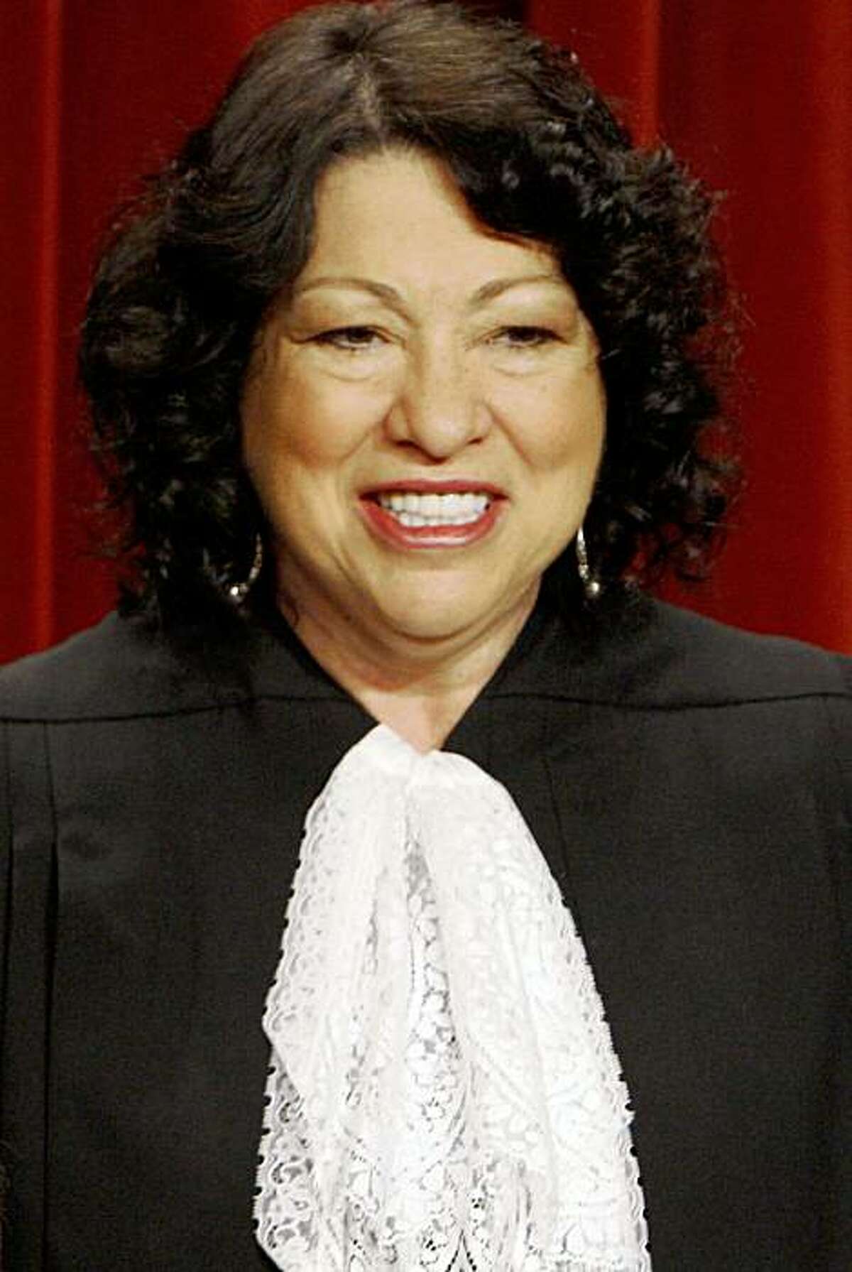 ** ADVANCE FOR SUNDAY, OCT. 4 AND THEREAFTER ** FILE - In this Sept. 29, 2009 file photo, the newest Supreme Court member, Justice Sonia Sotomayor, poses with her colleagues at the Supreme Court in Washington. (AP Photo/Charles Dharapak)