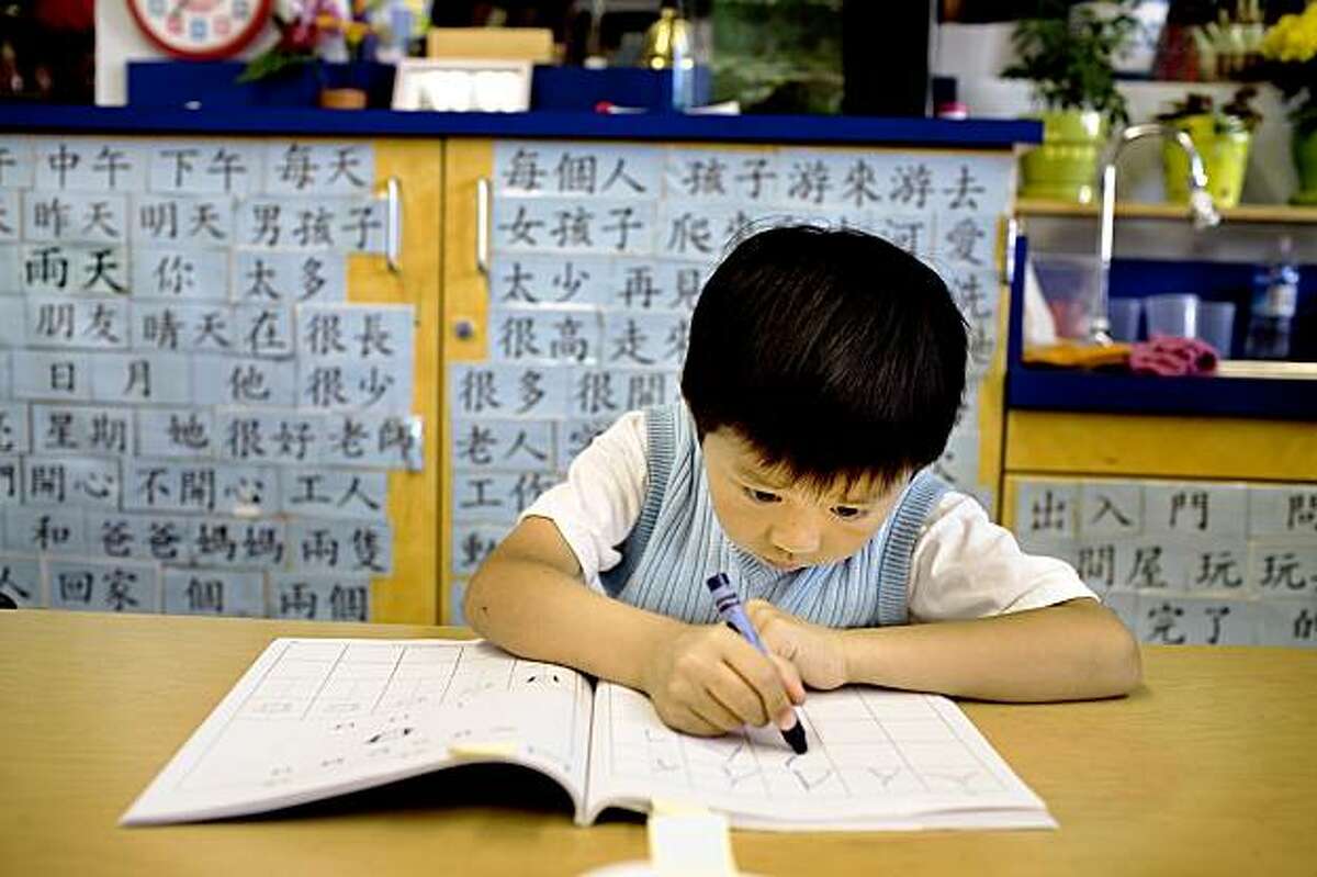 Ryan Luu, 4, a kindergarten student at West Portal Elementary School, works on Chinese characters in the Chinese immersion program, which celebrates the 25th anniversary, in San Francisco, Ca., on Friday, Sept. 11, 2009. Since then, many Chinese programs have opened in the city and the country.