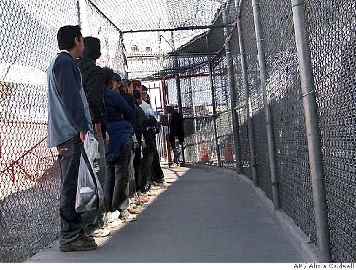 ###Live Caption:Illegal immigrants from Mexico wait in a holding area in El Paso, Texas, Thursday, May 1, 2008. U.S. Border Patrol agents have discretion to send illegal immigrants home instead of throwing them in jail. In some cases, they do it over and over and over. (AP Photo/Alicia Caldwell)###Caption History:Illegal immigrants from Mexico wait in a holding area in El Paso, Texas, Thursday, May 1, 2008. U.S. Border Patrol agents have discretion to send illegal immigrants home instead of throwing them in jail. In some cases, they do it over and over and over. (AP Photo/Alicia Caldwell)###Notes:###Special Instructions:BEST QUALITY AVAILABLE