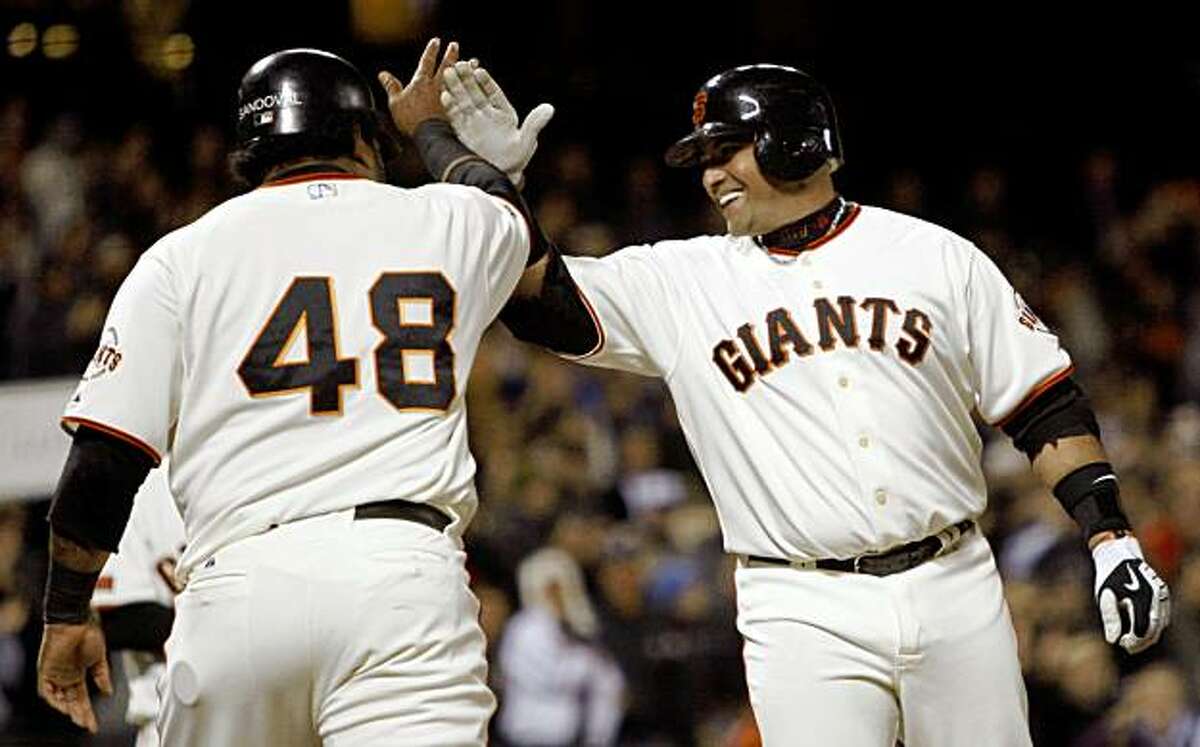 San Francisco Giants' Pablo Sandoval, right, celebrates his two