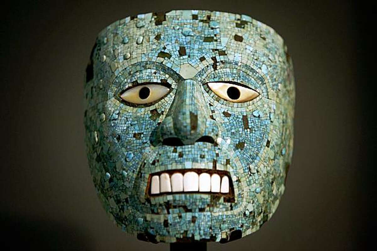 This Monday Sept. 21, 2009 photo shows a turquoise mask, representing probably Tonatiuh, the sun god, is seen at the exhibition entitled: 'Moctezuma: Aztec Ruler', in central London's British Museum, Moctezuma II was the last elected Aztec Emperor that reigned between 1502-1520 and the exhibition will run from Sept 24, to Jan. 24, 2010. Loans of material from Mexico and Europe will be displayed and according to the museum, this is the first exhibition to examine the semi-mythical statues of the ruler and his legacy. (AP Photo/Lefteris Pitarakis)