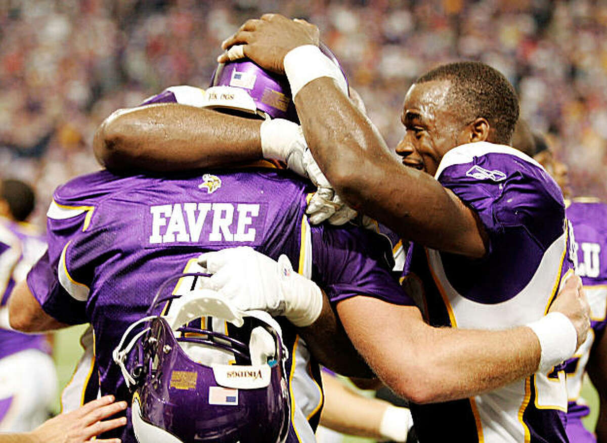 MINNEAPOLIS, MN - SEPTEMBER 27: Quarterback Brett Favre #4 of the Minnesota Vikings celebrates with teammate Adrian Peterson #28 after defeating the San Francisco 49ers 27-24 at Hubert H. Humphrey Metrodome on September 27, 2009 in Minneapolis, Minnesota. Favre threw a 32-yard pass for a touchdown with two seconds left in the game for the win. (Photo by Genevieve Ross/Getty Images)