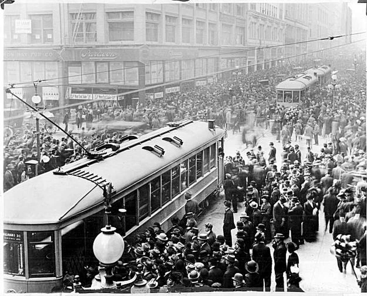MUNI1/B/05OCT99/MN/HO--Muni streetcars at Geary and Kearny Streets on the first day, December 28, 1912.