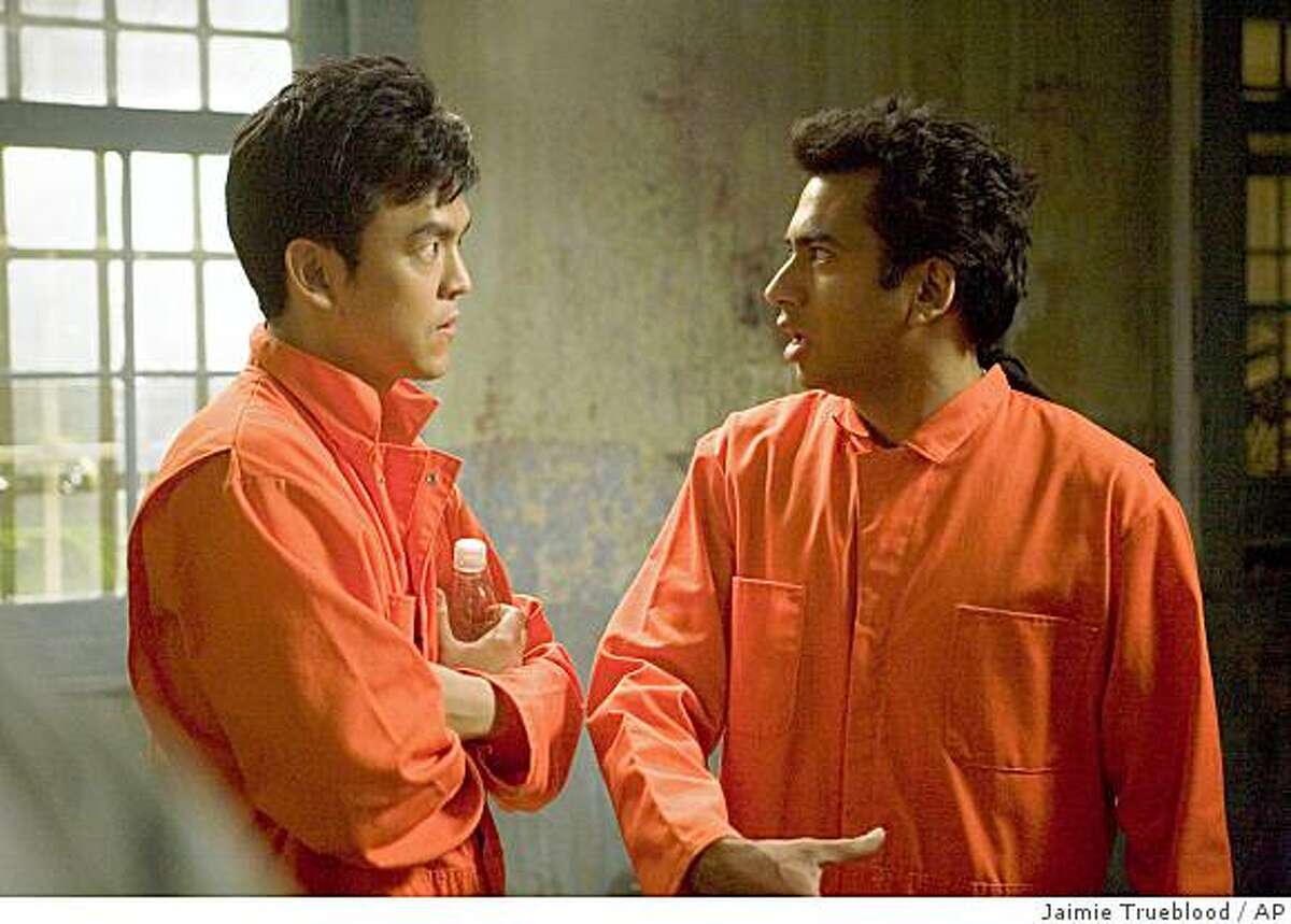 In this image provided by New Line Cinema, John Cho, left, and Kal Penn, are shown in a scene from New Line Cinema's "Harold and Kumar Escape from Guantanamo Bay". (AP Photo/New Line Cinema, Jaimie Trueblood) ** NO SALES **