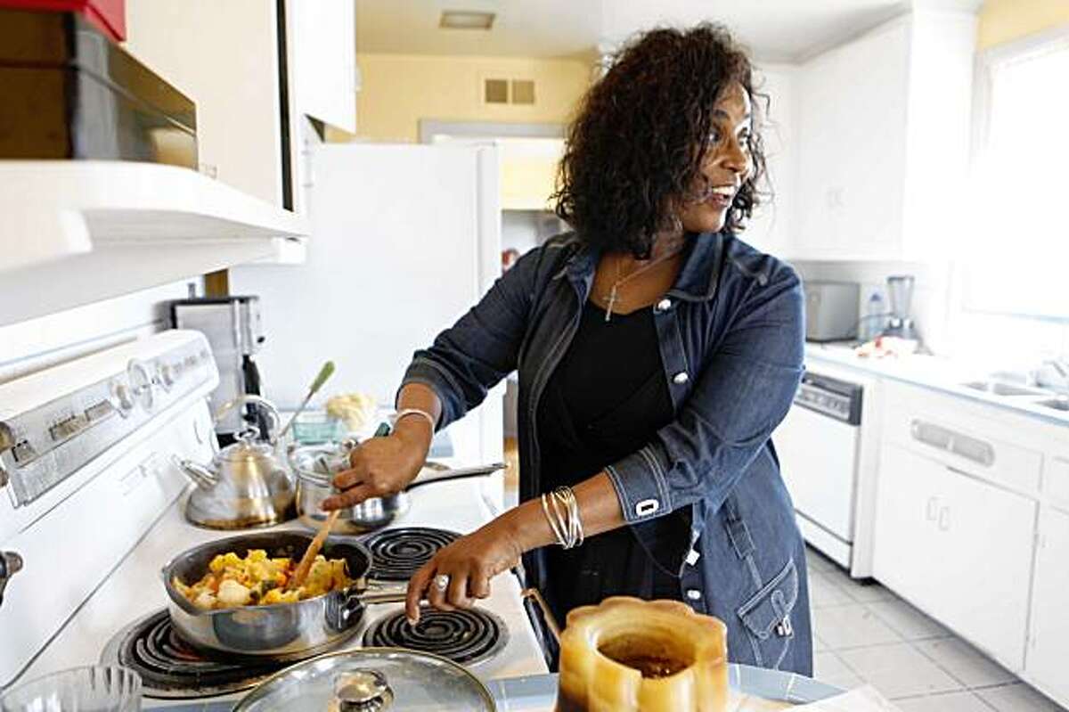 Netsanet Alemayehu from Sheba piano Lounge cooks her Cauliflower Warm Salad in her home on Monday Aug. 24, 2009 in San Francisco, Calif.