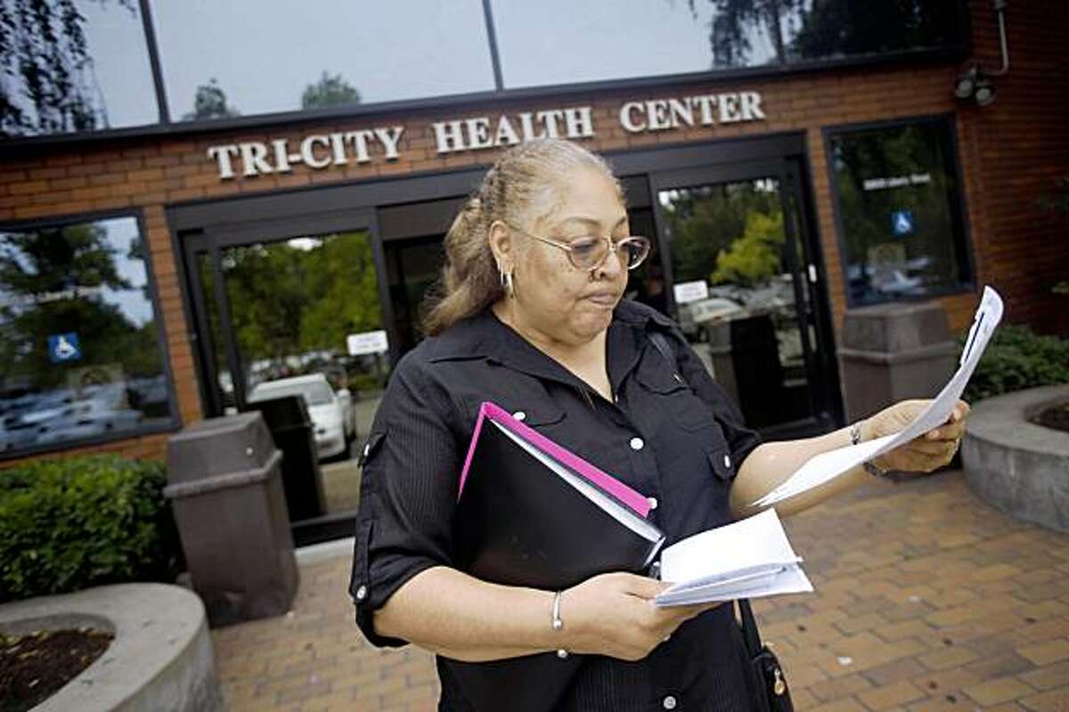 Inge Marie Phillips of Newark looks over her lab forms outside of Tri-City Health Center where she picked up the request for lab work in Fremont, Calif. on Monday, August 31, 2009.