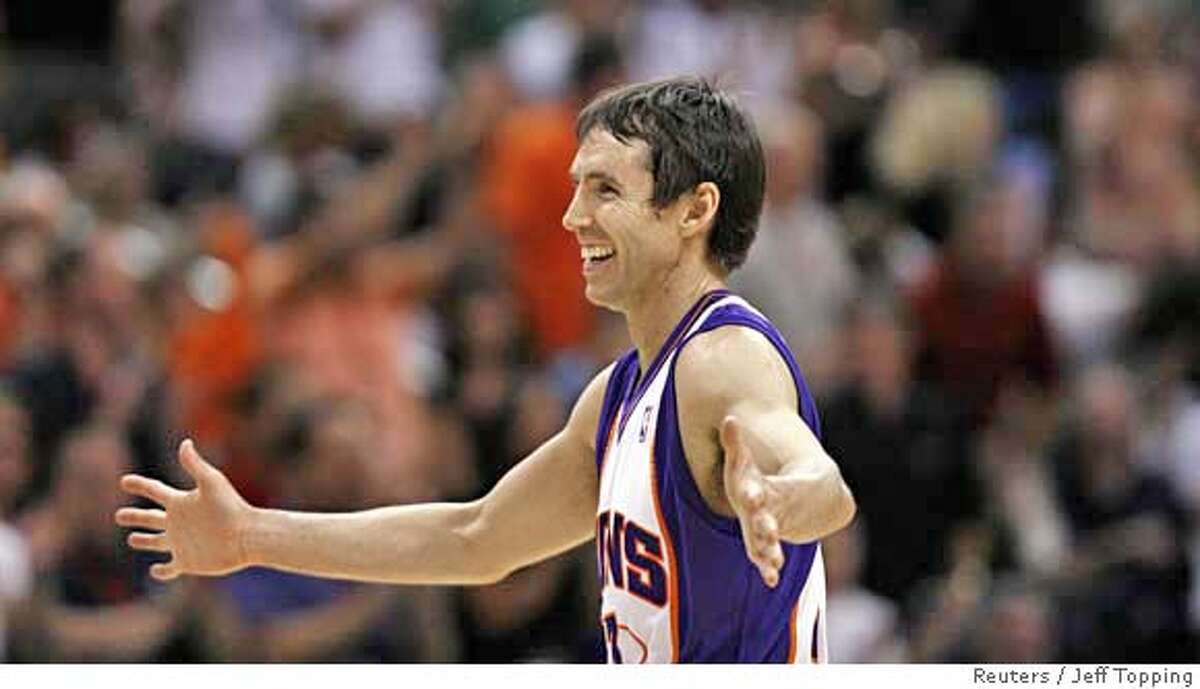 Phoenix Suns Steve Nash smiles as he leaves the court during a time out in the first quarter of their NBA basketball game against the Golden State Warriors in Phoenix, Arizona April 14, 2008. REUTERS/Jeff Topping (UNITED STATES)