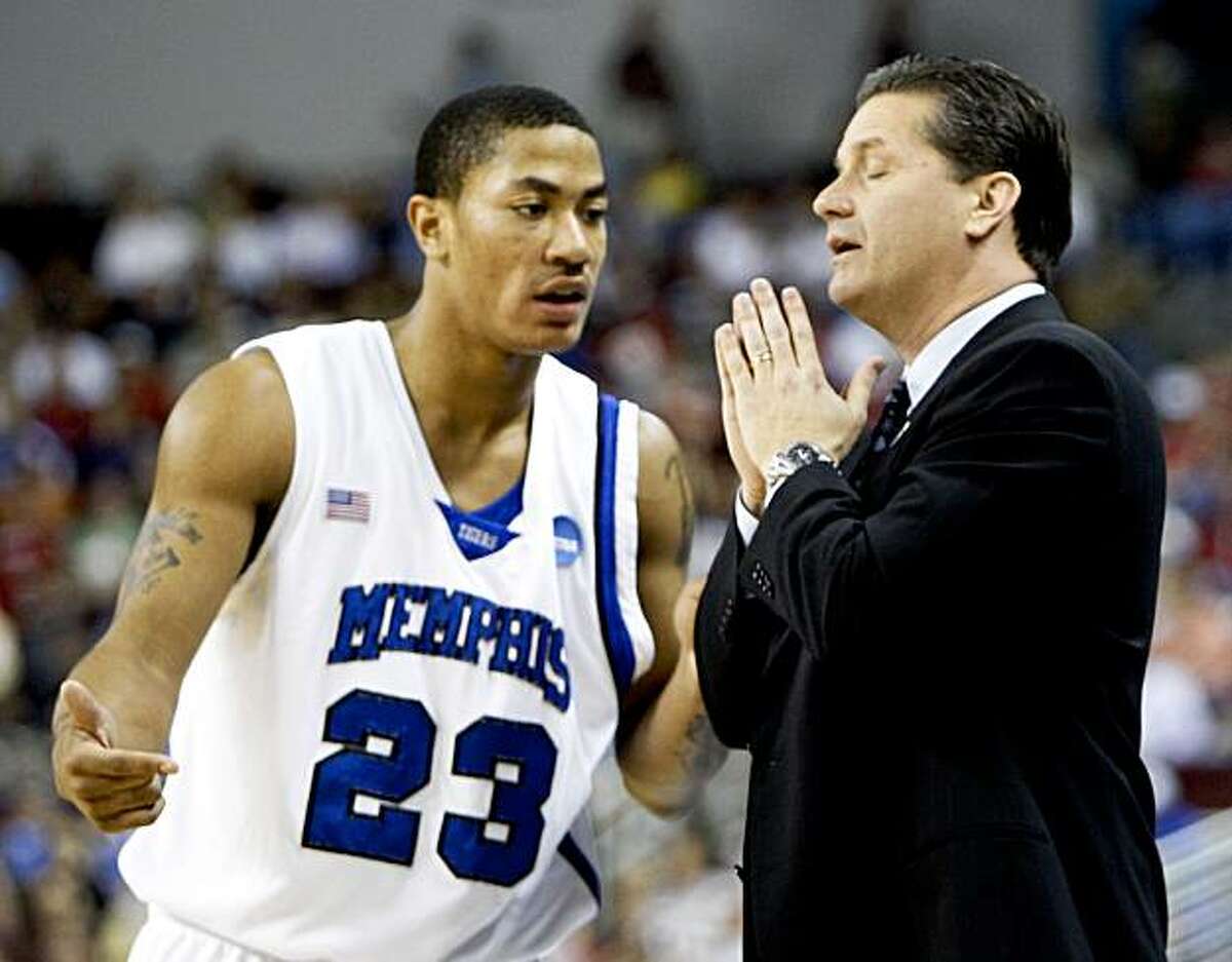 FILE -- This is a March 23, 2008, file photo showing Memphis coach John Calipari talking to Memphis guard Derrick Rose (23) during a time out in the first half of an NCAA basketball game against Mississippi State, in North Little Rock, Ark. Memphis will be forced to vacate the record 38 victories from its Final Four season of 2007-08, according to a report by the Memphis Commercial Appeal. (AP Photo/Sue Ogrocki, File)