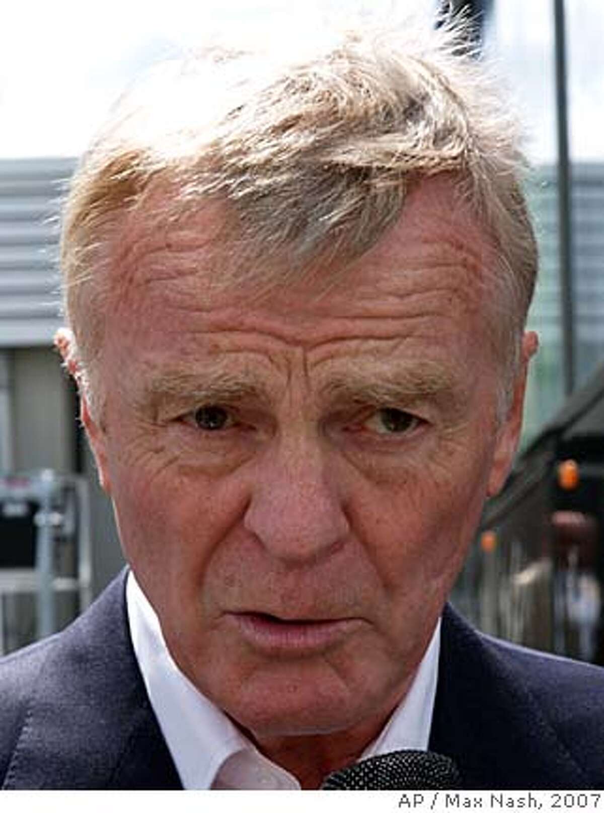 ** FILE ** Max Mosley, president of the FIA, motor sport's governing body, answers reporters questions regarding the issue between McLaren and Ferrari, at the paddock at Silverstone, England, in this July 7, 2007 file photo. FIA wants to stay clear of the situation involving its president, Max Mosley, and a British tabloid that reported he engaged in sexual acts with five prostitutes in a scenario that involved Nazi role-playing. "This is a matter between Mr. Mosley and the newspaper," the governing body of world auto racing said Sunday, March 30, 2008. Mosley, the son of British Union of Fascists party founder Oswald Mosley, reportedly took part in the scene on Friday at a London apartment near his home, according to the News of the World in a front-page story. (AP Photo/Max Nash)