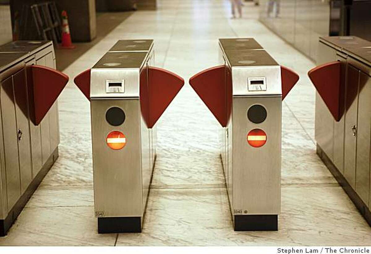 A BART turnstiles awaits the next wave of commuters at Embarcadero station during early morning rush hours in San Francisco Monday morning, June 29, 2009. BART and its two largest unions have agreed to extend labor contract through July 9 to continue ongoing new contract negotiations and forestall possible strike which would cripple the regions traffic and public transportation system. BART currently carries approximately 355,000 riders on a daily basis.