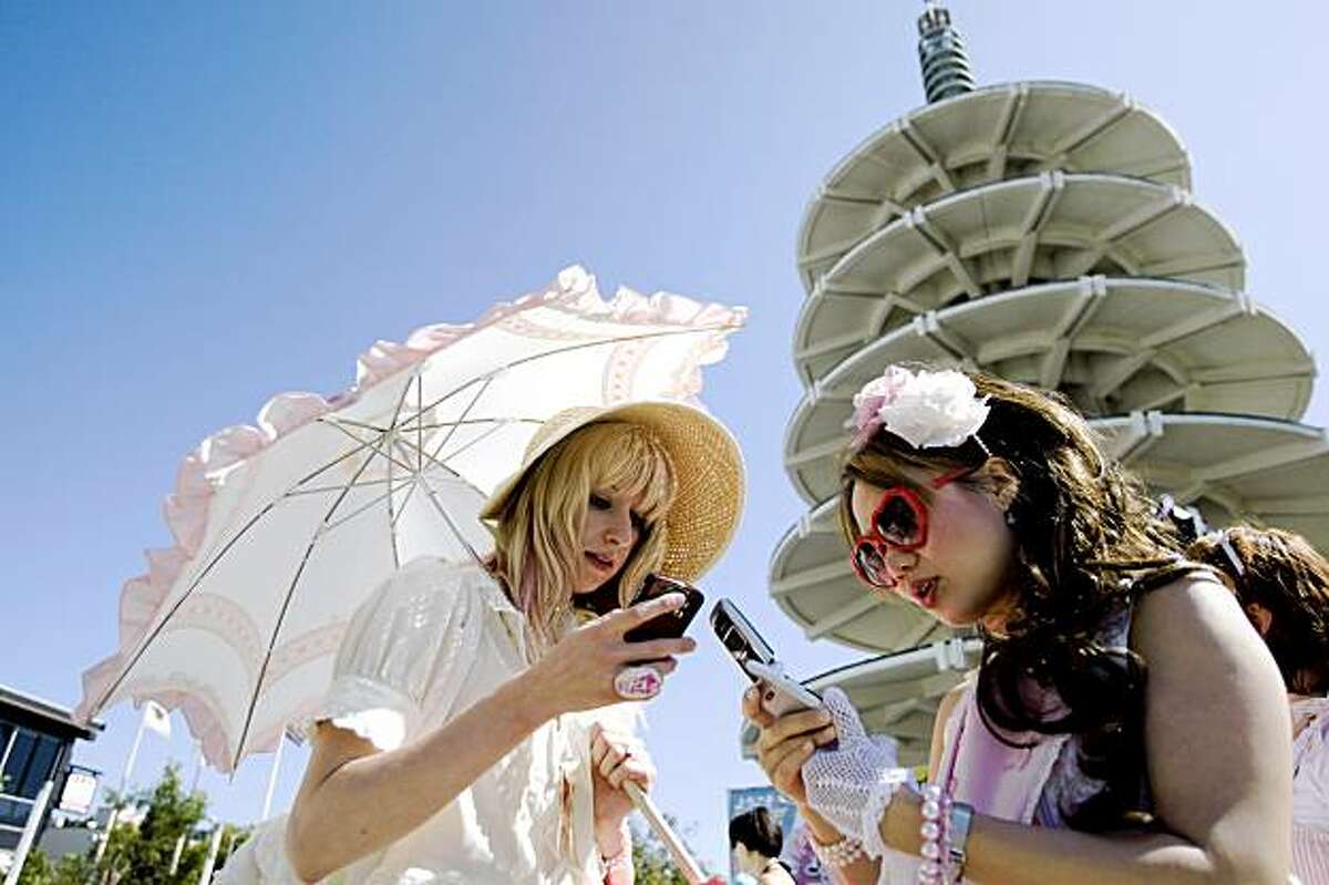 Sarah Frank and Ada exchange numbers while attending the J-Pop Summit Festival in Japantown in San Francisco on Saturday.