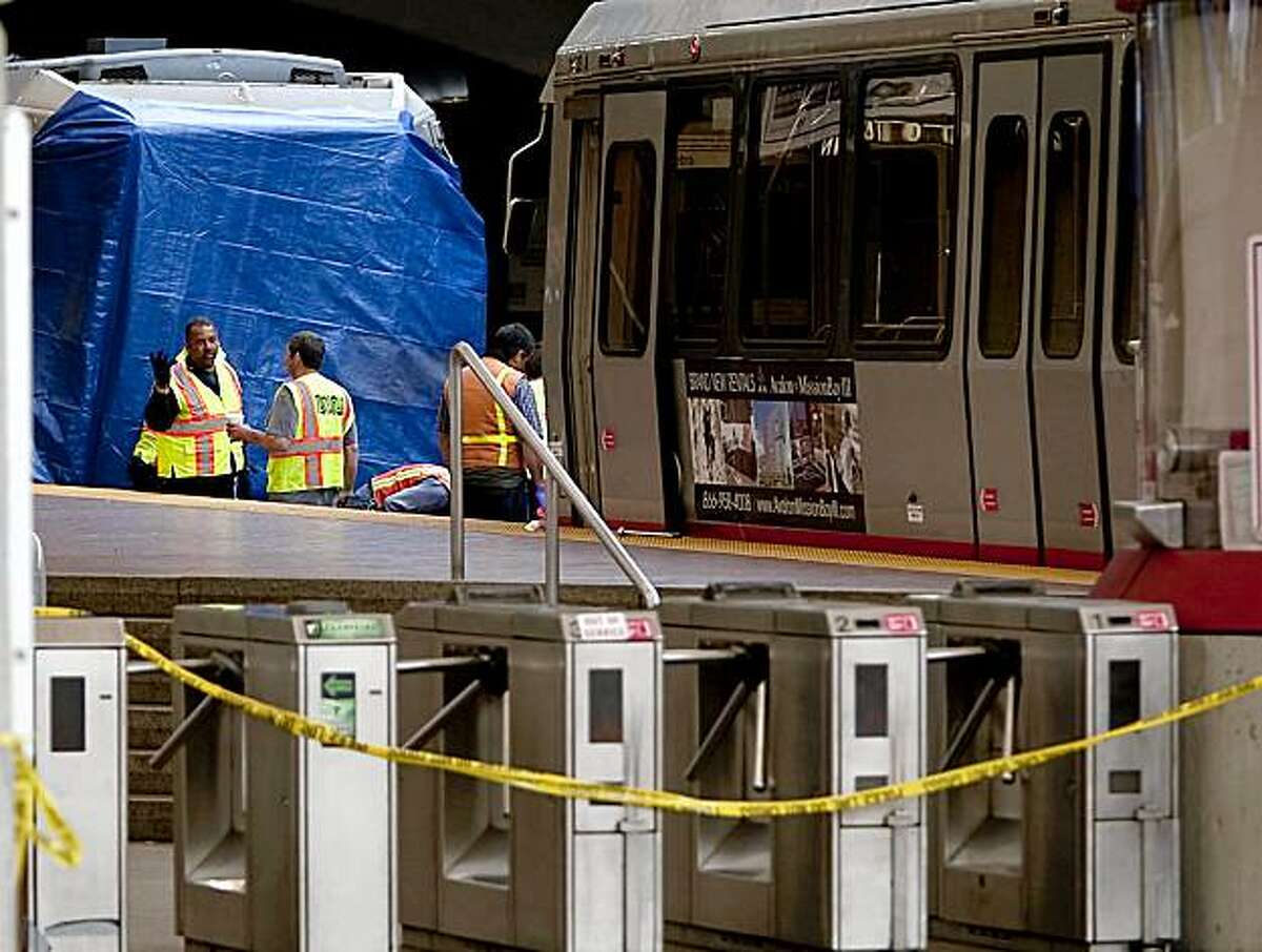 MUNI personnel works on the scene at West Portal Station after an outbound L Taraval and outbound K Ingleside train collided at West Portal MUNI station in San Francisco, Calif. Saturday, July 18, 2009.