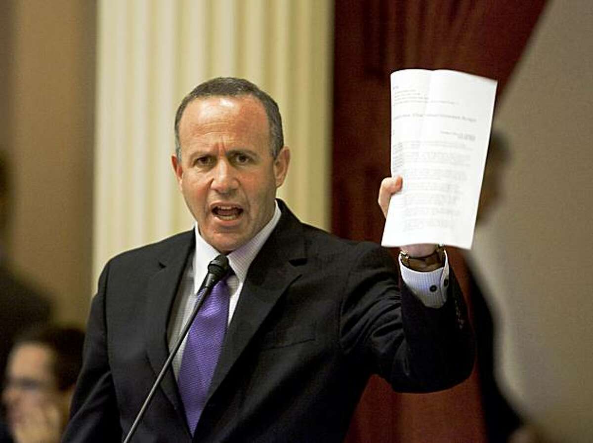 SACRAMENTO, California-Darrell Steinberg (D- Sacramento) president pro tem of the state Senate on the the floor of the state senate Juune 24, 22009, shows a press release announcing the proposal for the state to issue IOU's after July 1 or July 2 if a balanced budget is not passed, With time running out, the state Assembly and state Senate debate meet to close the state's $24 billion deficit. But chances of approval are slim to none with Republicans balking at the Democrats tax proposals and arguing for deeper cuts.