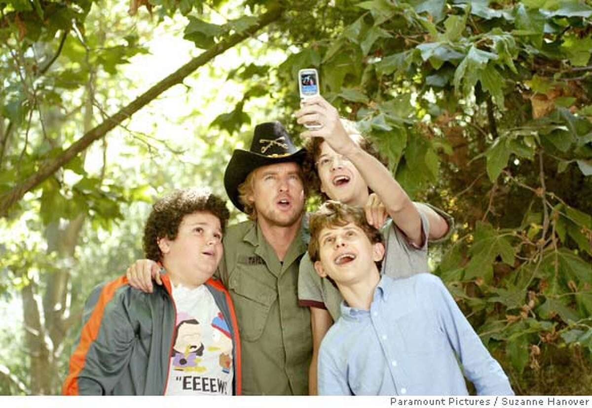 (Left to right) Ryan (Troy Gentile), Drillbit Taylor (Owen Wilson), Wade (Nate Hartley) and Emmit (David Dorfman) conspire to defeat a nasty school bully in Drillbit Taylor. Paramount Pictures Presents An Apatow/Roth/Arnold Production A Steven Brill Film Drillbit Taylor starring Owen Wilson, Leslie Mann, Danny McBride and Josh Peck. The film is directed by Steven Brill from a screenplay by Kristofor Brown & Seth Rogen. The story is by Edmond Dantes and Kristofor Brown & Seth Rogen. The producers are Judd Apatow, Susan Arnold and Donna Arkoff Roth. The executive producer is Richard Vane. This film has been rated PG-13 for crude sexual references throughout, strong bullying, language, drug references and partial nudity. Photo Credit: Suzanne Hanover