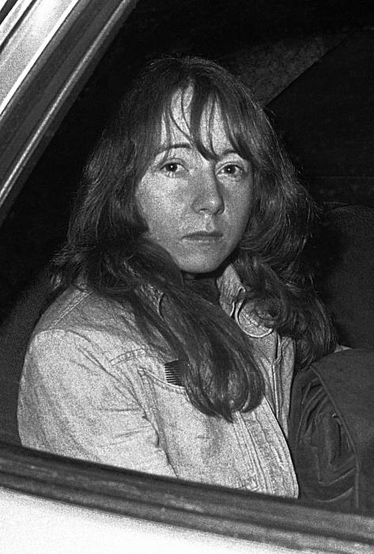 FILE - In this Nov. 25, 1975 file photo, Lynette Fromme sits in a U.S. Marshal's auto in Sacramento, Calif. as she returned to jail when jurors in her trial recessed for the evening. Fromme is accused of attempting to assassinate President Ford with a gun outside the California Capitol in Sacramento on Sept. 5. The Federal Bureau of Prisons and the court-appointed attorney who represented Fromme at trial say the now 60-year-old is to be released from the Federal Medical Center Carswell in Fort Worth, Texas, on Aug. 16, 2009. (AP Photo/Walt Zeboski, Pool)