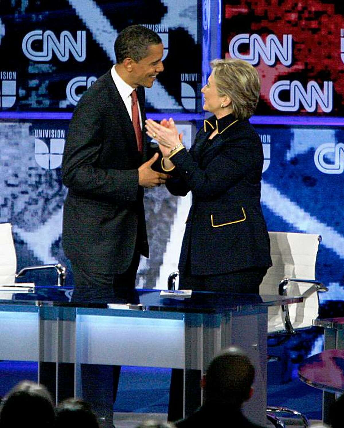 AUSTIN, TX - FEBRUARY 21: Democratic presidential hopefuls U.S. Sen. Barack Obama (D-IL) and U.S. Sen. Hillary Clinton (D-NY) speak after participating in a debate Lyndon B. Johnson Auditorium at the University of Texas on February 21, 2008 in Austin, Texas. The debate was sponsored by the Texas Democratic Party, Univision and CNN and was ahead of the Texas and Ohio primaries being held on March 4th. (Photo by Ben Sklar/Getty Images)