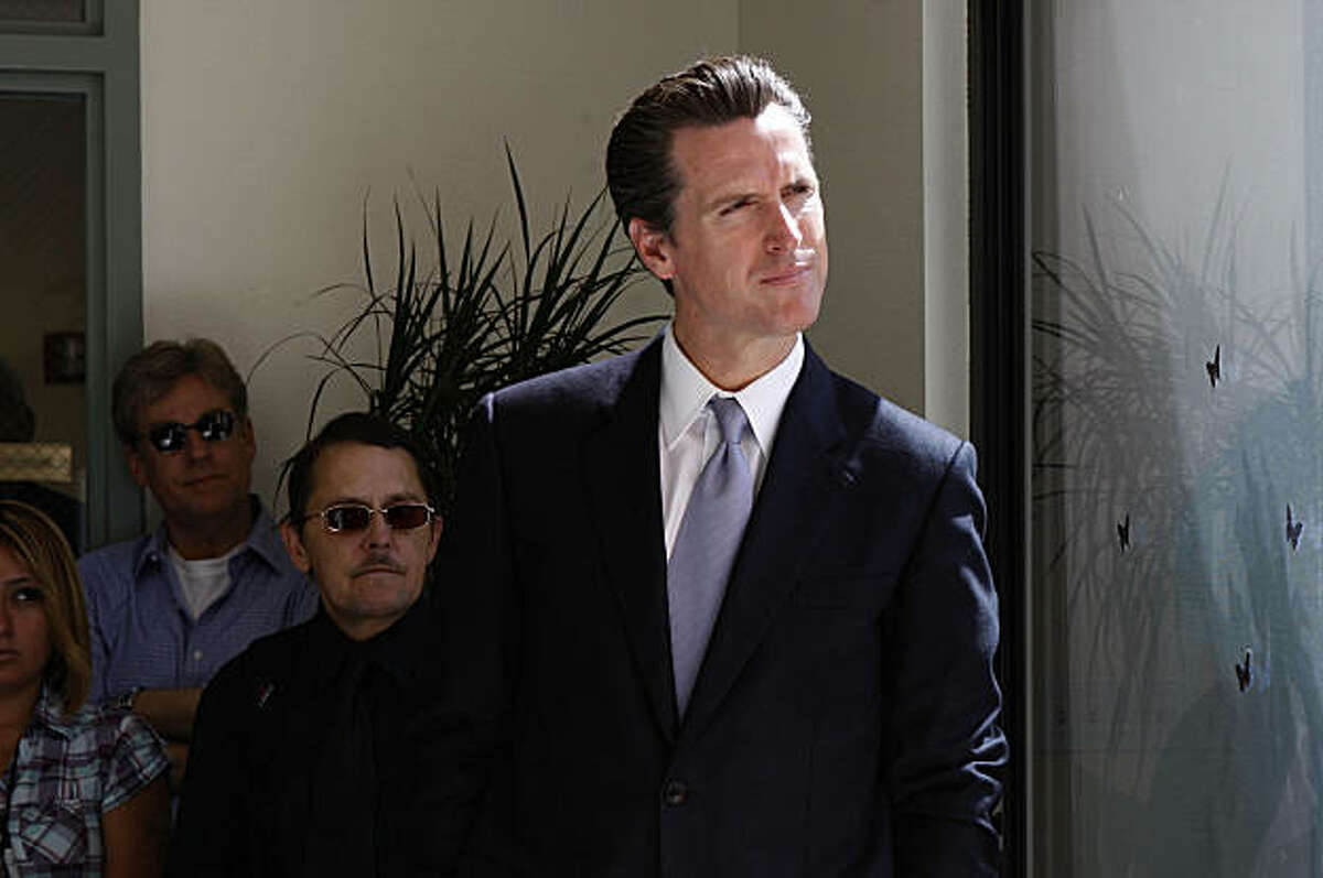 Mayor Newsom looks onto the patio as he waits to introduce the new medical respite and sobering center, at a press conference on Mission St. in San Francisco , Calif., on Wednesday, July 1, 2009.