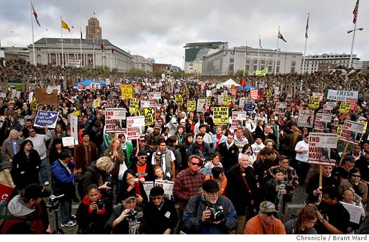 Protesters filled Civic Center Plaza to listen to speaches before a march into the Mission district. The five year anniversary of the Iraq war was remembered by protesters at San Francisco's Civic Center Wednesday, March 19, 2007. Photo by Brant Ward / San Francisco Chronicle