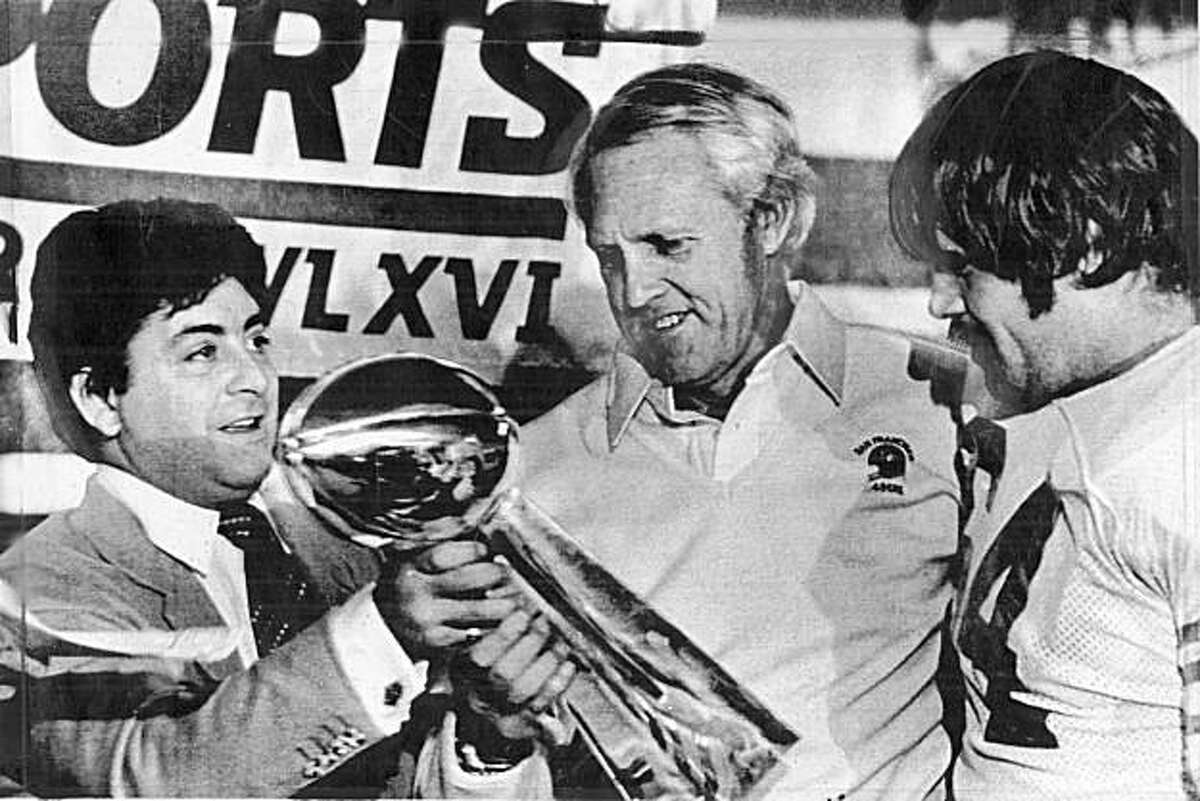 Eddie DeBartolo and 49ers coach Bill Walsh hold up the Super Bowl trophy for Super Bowl XVI on January 24, 1982.
