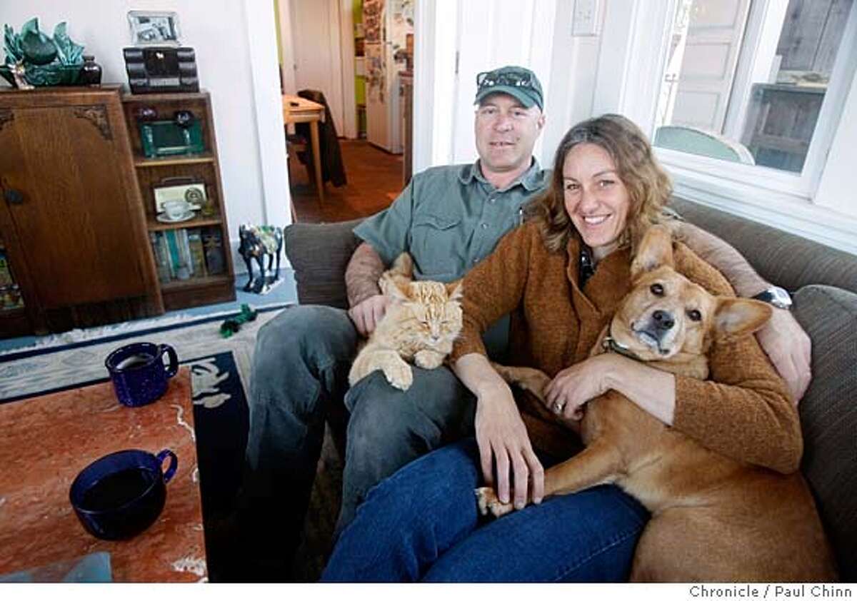 ###Live Caption:David Silva and his wife Elizabeth Pepin Silva have their morning coffee with their cat, Sam, and dog, Keala, at their home in San Francisco, Calif., on Wednesday, March 5, 2008. After years of trying, the couple's TIC arrangement is finally eligible for a condo conversion after winning in the city's competitive lottery system. Photo by Paul Chinn / San Francisco Chronicle###Caption History:David Silva and his wife Elizabeth Pepin Silva have their morning coffee with their cat, Sam, and dog, Keala, at their home in San Francisco, Calif., on Wednesday, March 5, 2008. After years of trying, the couple's TIC arrangement is finally eligible for a condo conversion after winning in the city's competitive lottery system. Photo by Paul Chinn / San Francisco Chronicle###Notes:David Silva, Elizabeth Pepin Silva###Special Instructions:MANDATORY CREDIT FOR PHOTOGRAPHER AND S.F. CHRONICLE/NO SALES - MAGS OUT