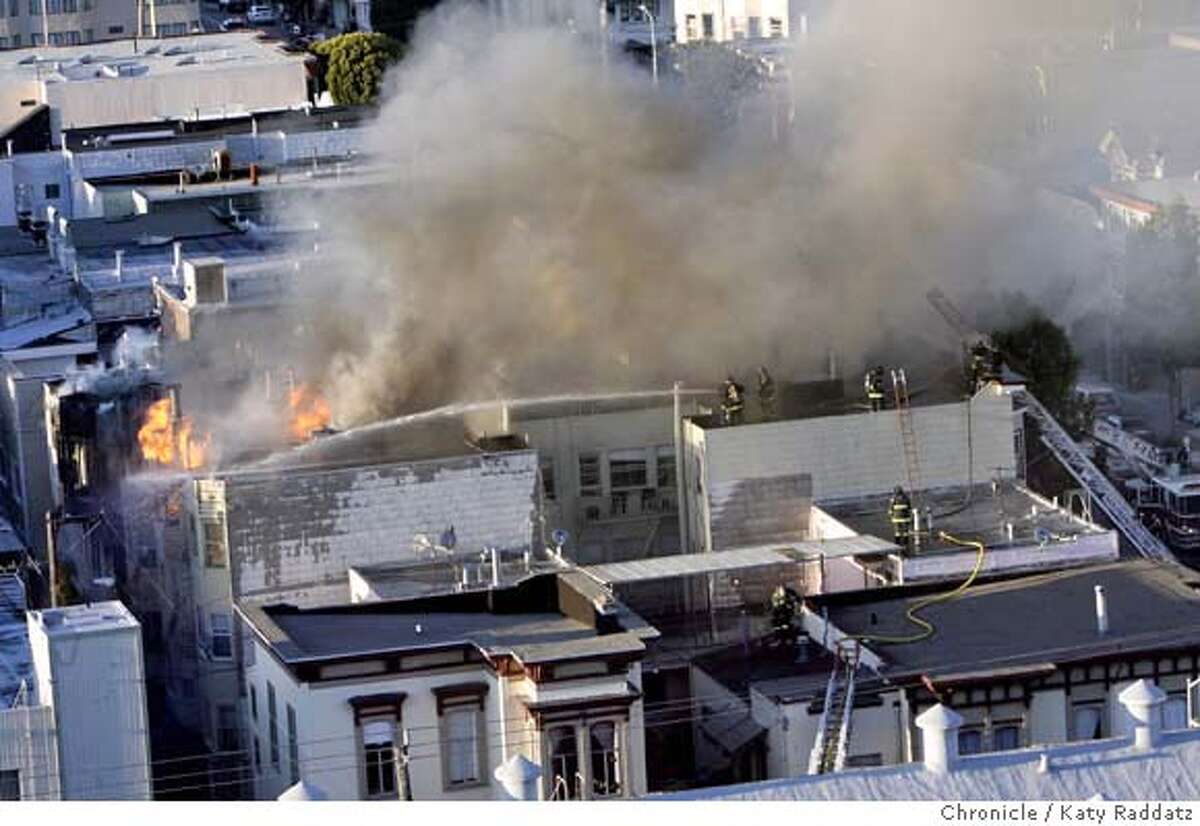A fire that is centered at 1470 Valencia St. consumes many buildings in the 1400 block, including the Dovre Club, in San Francisco, Calif. on Monday March 17, 2008. Photo by Katy Raddatz / San Francisco Chronicle