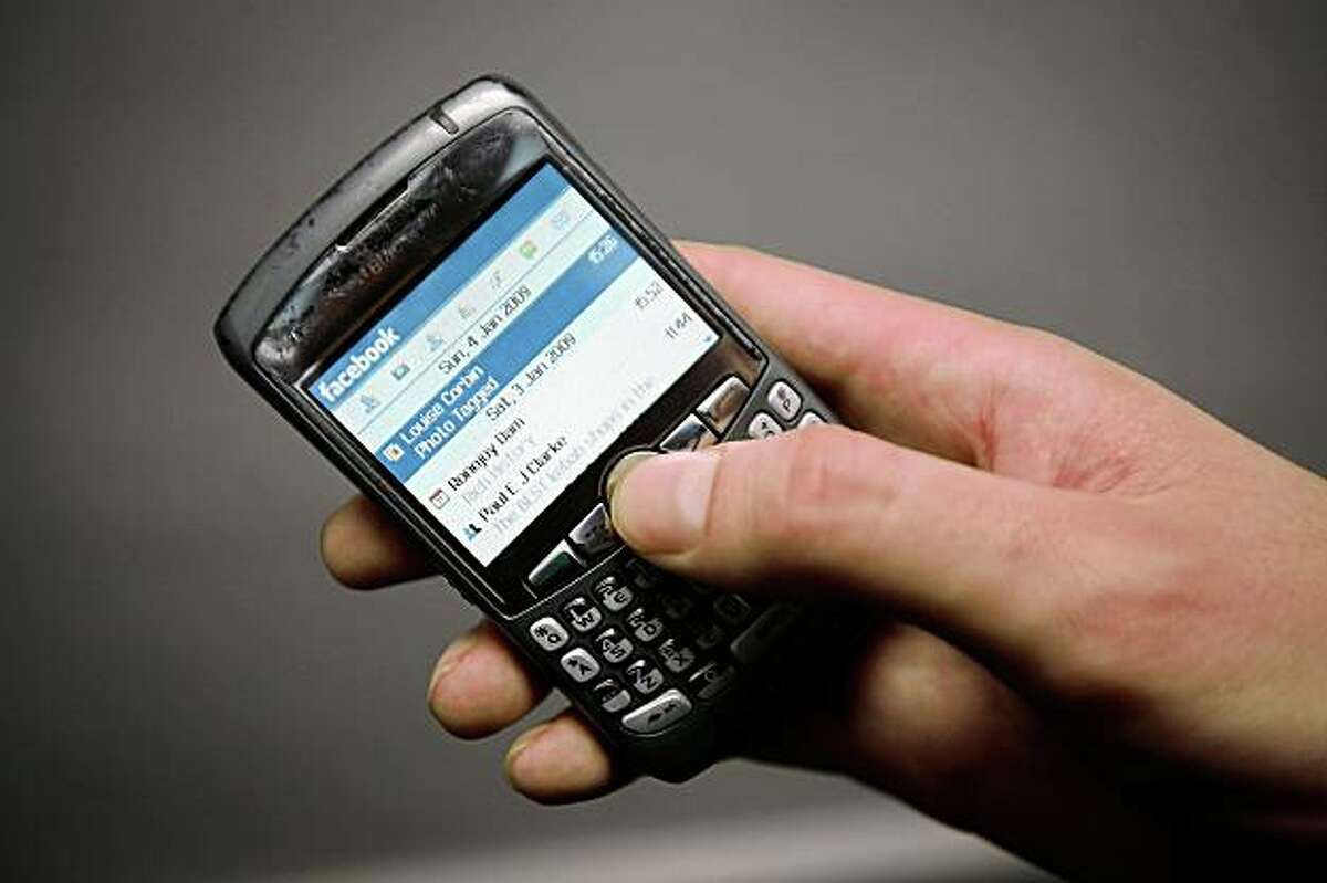 In this photo illustration the Social networking site Twitter is displayed on a mobile phone on March 25, 2009 in London, England. The British government has made proposals which would force Social networking websites such as Facebook to pass on details of users, friends and contacts to help fight terrorism.