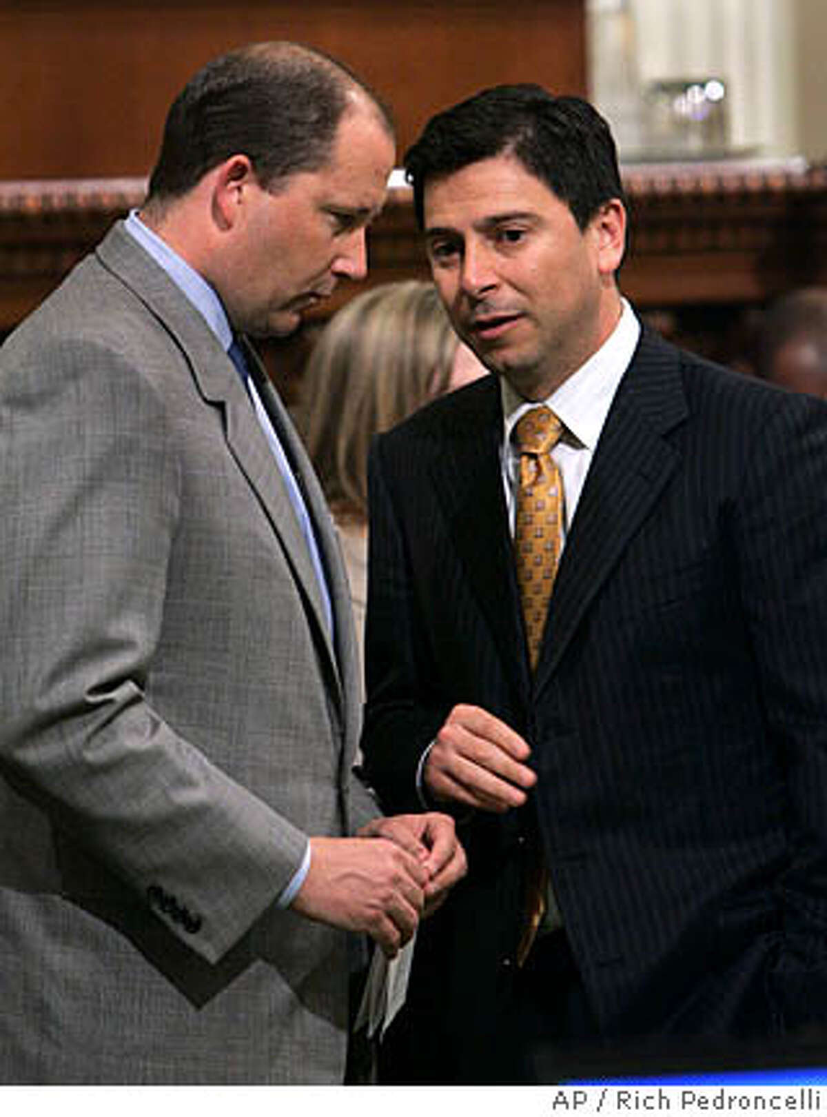 California assembly Minority Leader Mike Villines, R-Clovis, left, confers with Assembly Speaker Fabian Nunez, D-Los Angeles, as the Assembly debates a measure that would levy taxes on oil companies, at the Capitol in Sacramento, Calif., Wednesday, March 12, 2008. The measure, by Nunez, would tax petroleum companies 6 percent on the oil they extract in the state. Republicans opposed the measure which requires a two-thirds vote for passage. (AP Photo/Rich Pedroncelli)
