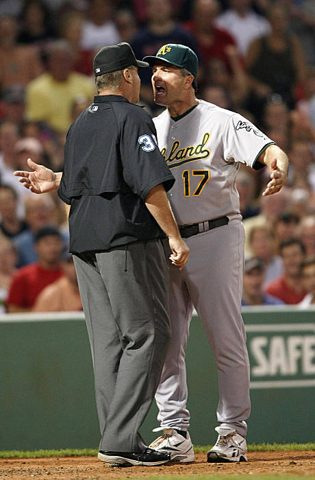 Boston Red Sox second baseman Dustin Pedroia lands on Oakland Athletics' Orlando  Cabrera, who is out at second, as he turns a double play to end the top of  the eighth inning