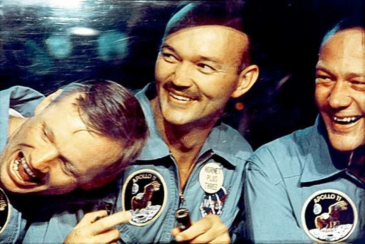 From left: Astronauts Neil Armstrong, Mike Collins and Buzz Aldrin in a Mobile Quarantine Facility aboard the USS Hornet after returning to Earth from the moon, July 24, 1969. The astronauts were quarantied for 65 hours to prevent the unlikely spread of lunar contagions.