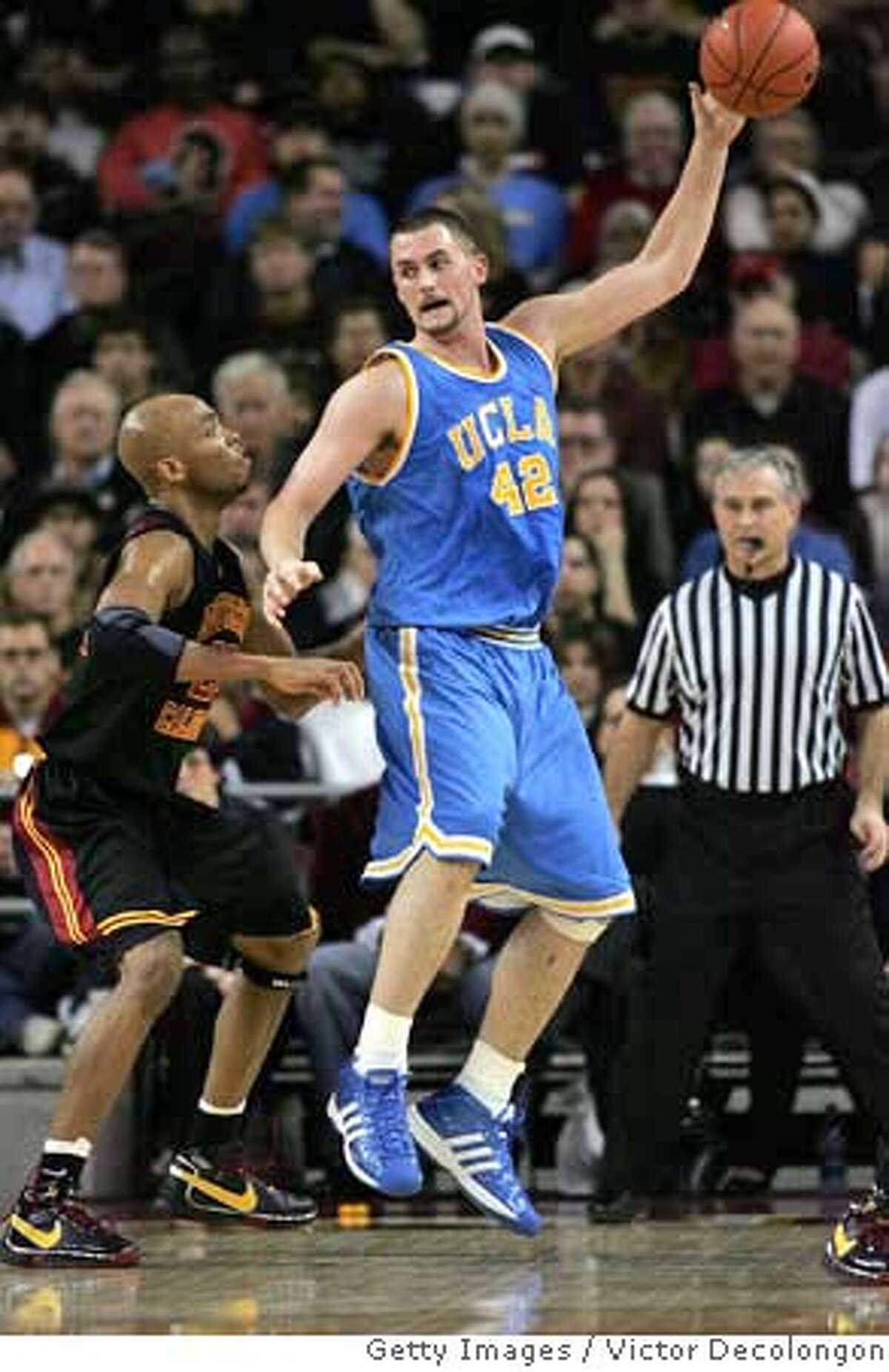 ###Live Caption:LOS ANGELES, CA - FEBRUARY 17: Kevin Love #42 of the UCLA Bruins gets the ball in the low post against Taj Gibson #22 of the USC Trojans in the first half during their Pac-10 Conference game at the Galen Center on February 17, 2008 in Los Angeles, California. (Photo by Victor Decolongon/Getty Images)###Caption History:LOS ANGELES, CA - FEBRUARY 17: Kevin Love #42 of the UCLA Bruins gets the ball in the low post against Taj Gibson #22 of the USC Trojans in the first half during their Pac-10 Conference game at the Galen Center on February 17, 2008 in Los Angeles, California. (Photo by Victor Decolongon/Getty Images)###Notes:UCLA v USC###Special Instructions:
