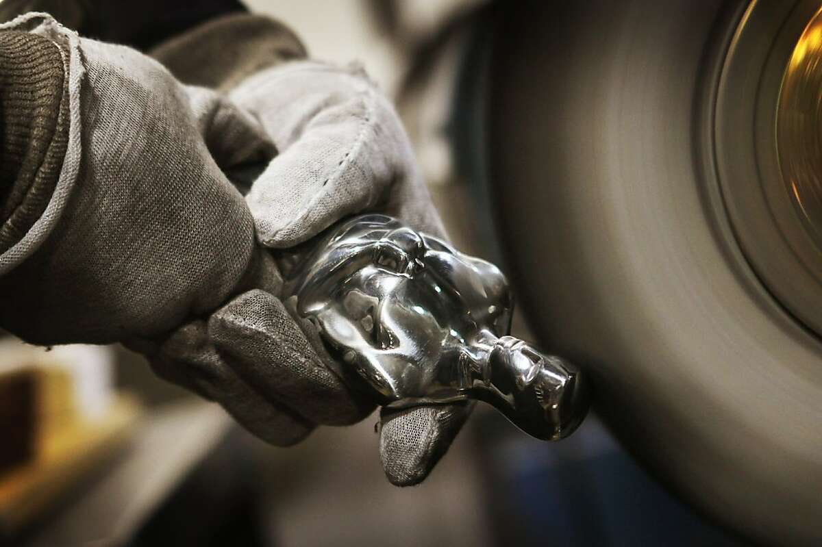 An Oscar statuette sits on a work bench at R.S. Owens & Company News  Photo - Getty Images