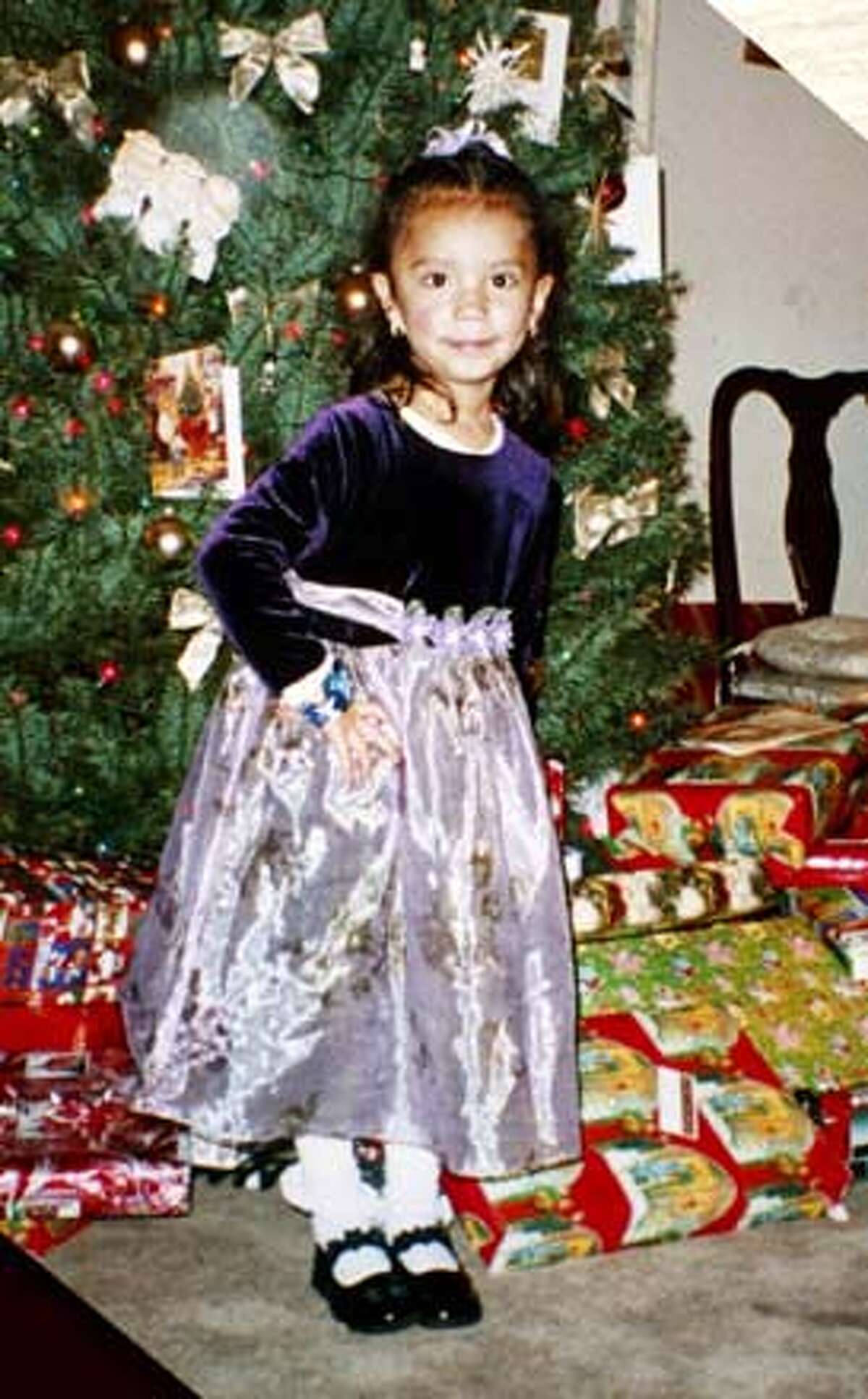 ###Live Caption:Copy photo of Elizabeth Dominguez, Christmas 2002. A memorial was set up at 24th and Portrero for 4 year old Elizabeth Dominguez, killed the day before when a truck spun out of control and pinned her against the side of a restaurant.###Caption History:MEMORIALd-C-12FEB03-MT-MJM Copy photo of Elizabeth Dominguez, Christmas 2002. A memorial was set up at 24th and Portrero for 4 year old Elizabeth Dominguez, killed the day before when a truck spun out of control and pinned her against the side of a restaurant. ALSO Ran on: 09-02-2005 Elizabeth Dominguez was walking with her mother on Feb. 11, 2003, when she was hit by a truck.###Notes:###Special Instructions:CAT