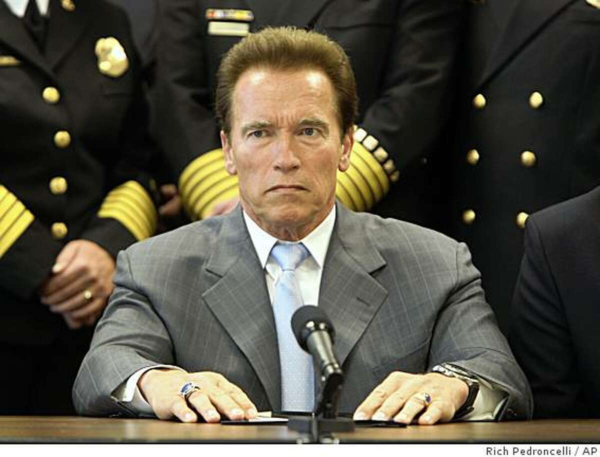 Gov. Arnold Schwarzenegger listens to a reporter's question concerning the state's pending cash crisis, following a meeting with the Governor's Blue Ribbon Fire Commission, at the Capitol in Sacramento, Calif., Monday, June 29, 2009. Schwarzenegger said he would veto any budget plan that includes tax increases and urged lawmakers to reach a solution to the states $24.3 billion state budget plan deficit. (AP Photo/Rich Pedroncelli)